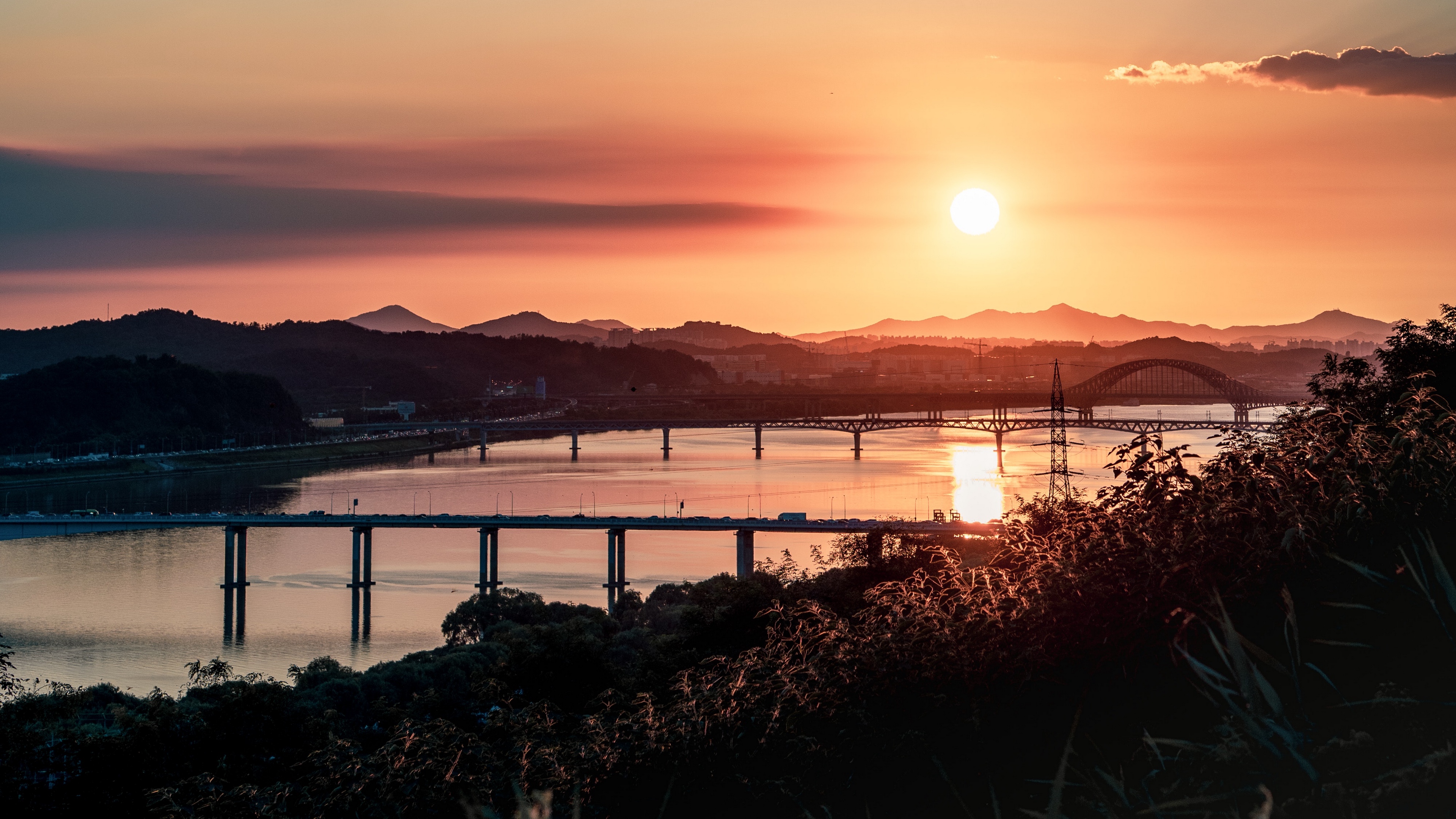 bridges sunset river clouds 4k 1538066201