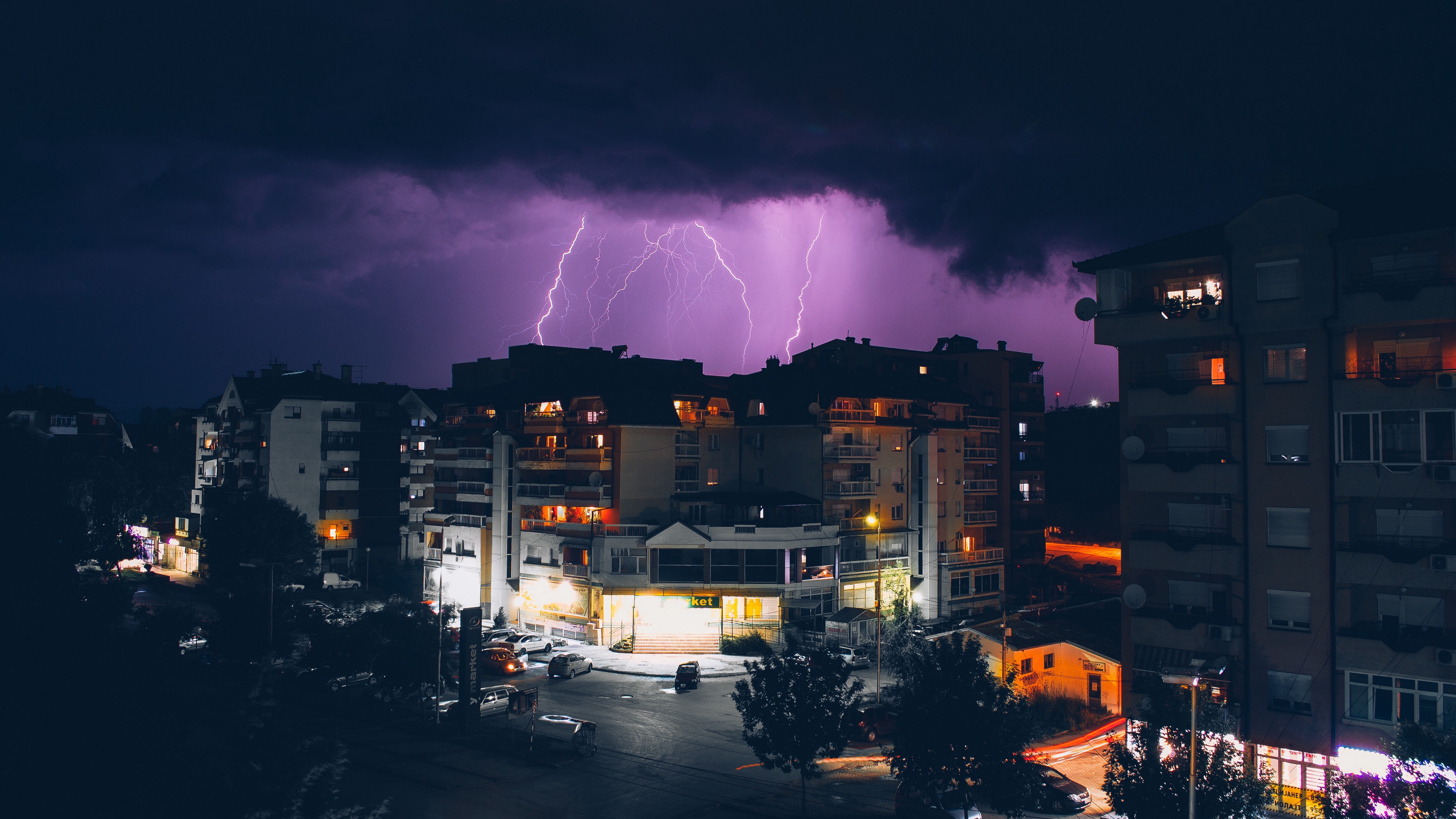 building storm overcast clouds 4k 1538065048