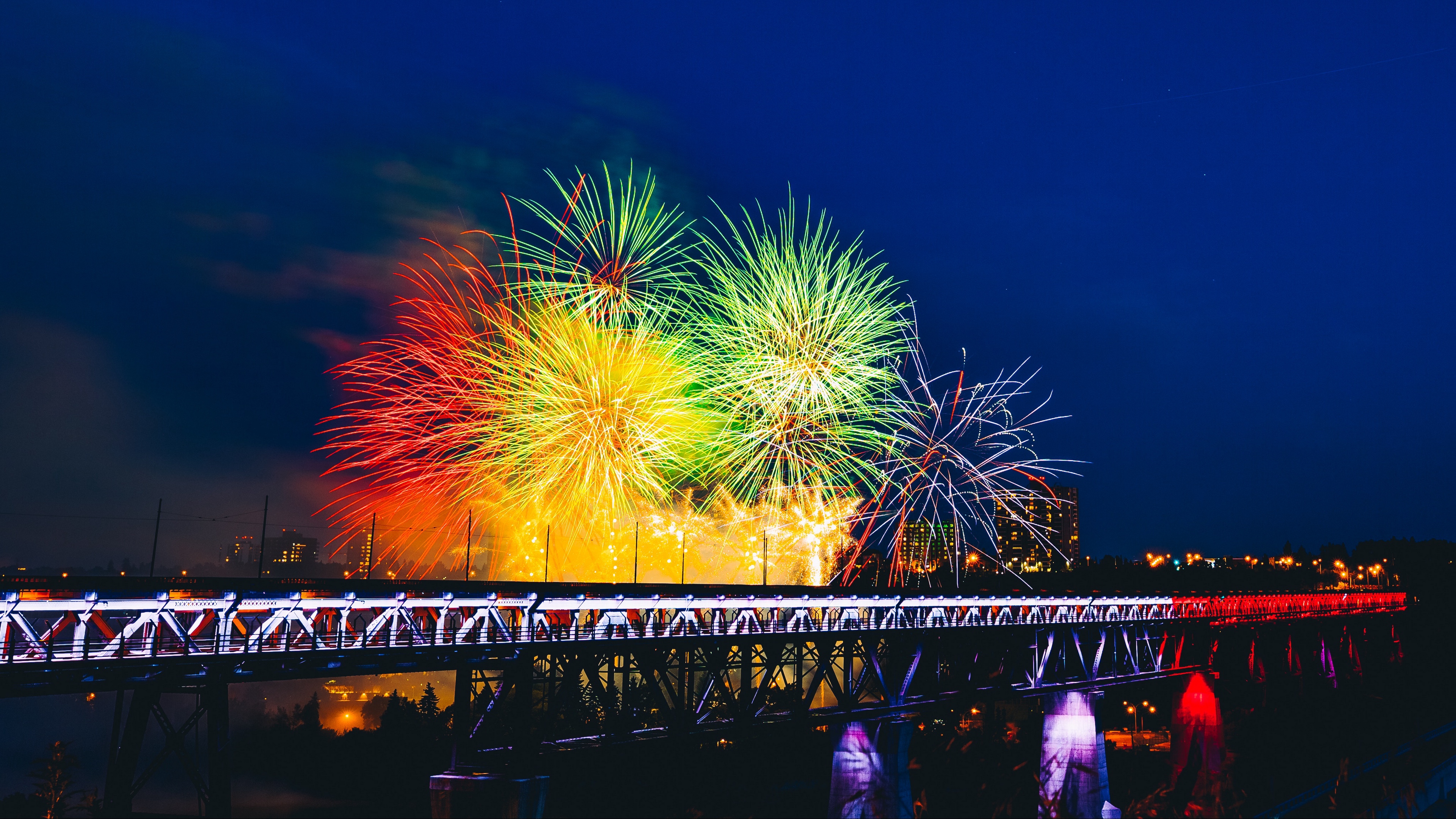 fireworks bridge holiday colorful 4k 1538345169