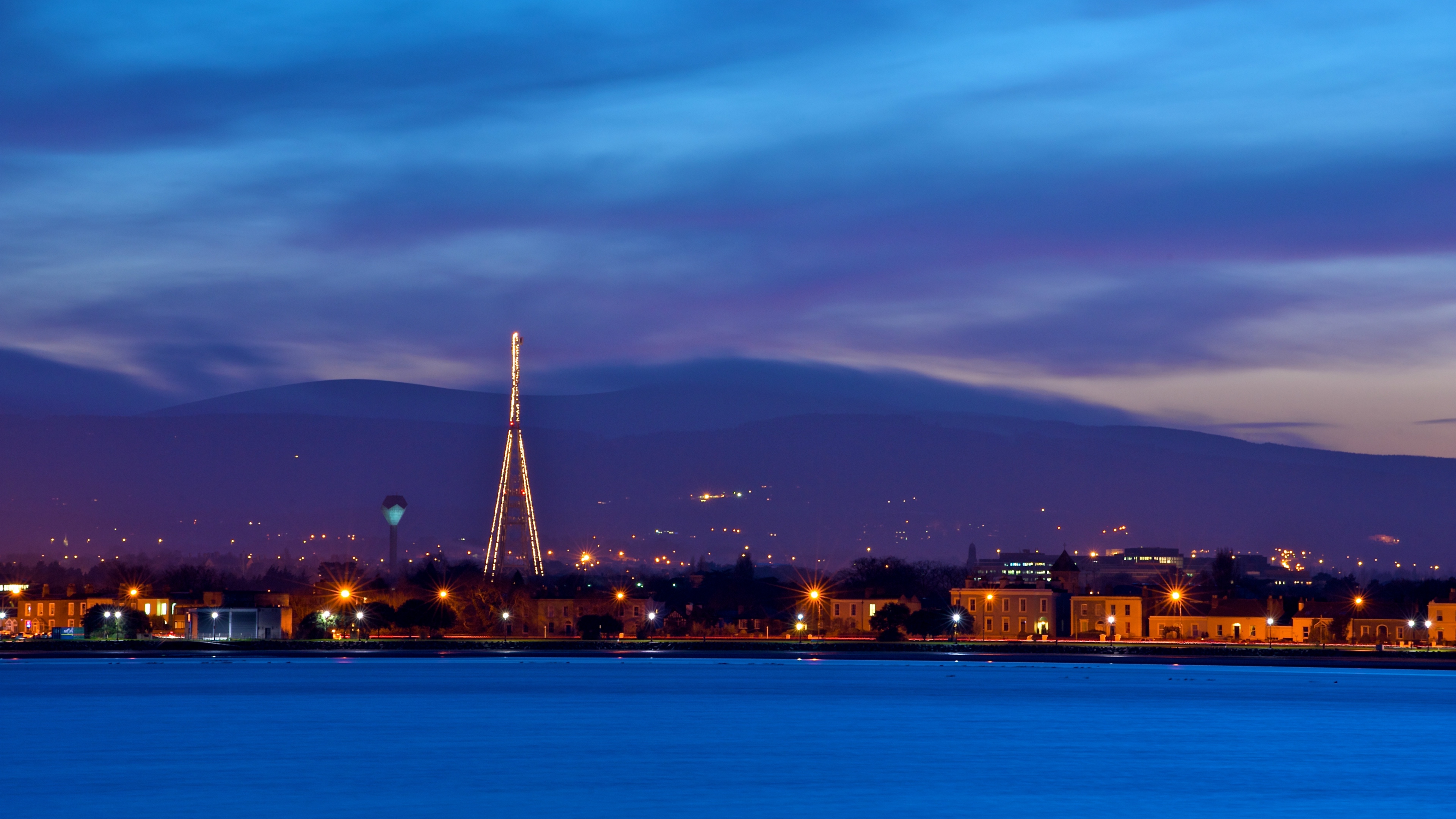 ireland dublin evening dusk sky blue clouds mountains houses lights quay river 4k 1538065666