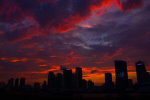 night city skyscrapers clouds horizon 4k 1538067506