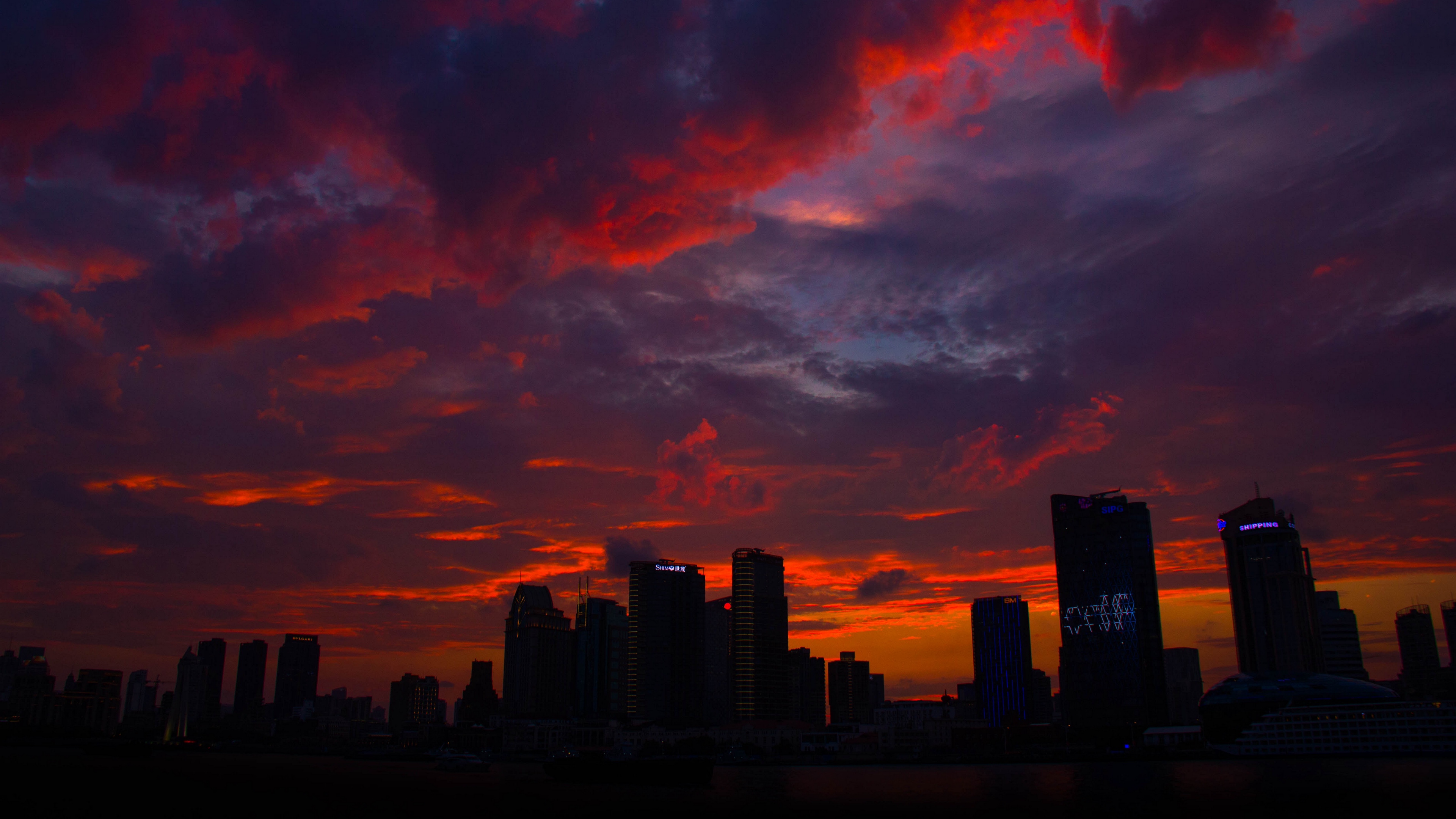 night city skyscrapers clouds horizon 4k 1538067506