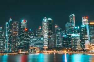 skyscrapers buildings night city beach 4k 1538067923