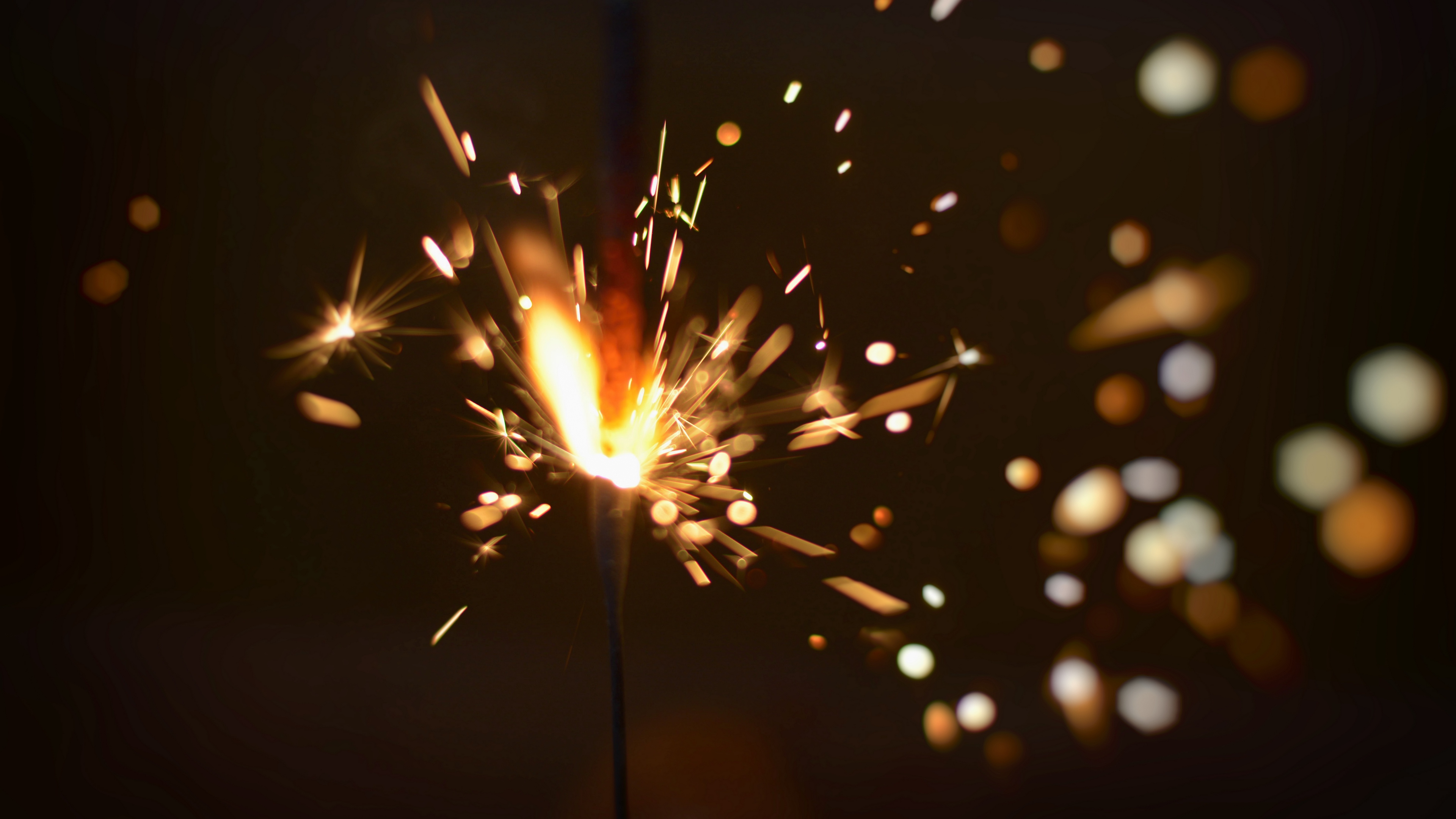 sparkler sparks glare 4k 1538344797