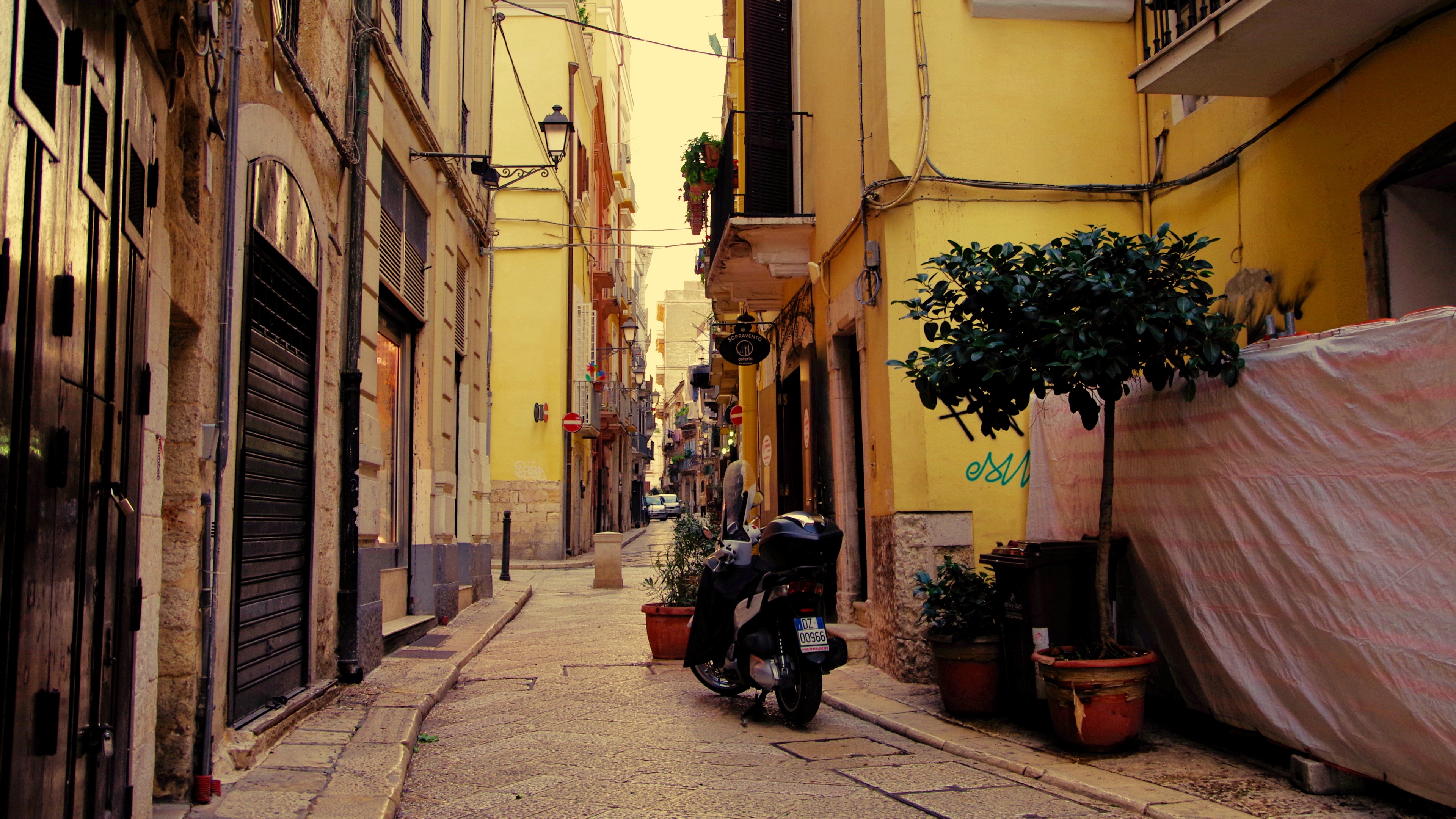 street motorcycle pavement buildings architecture 4k 1538068090