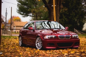 bmw red side view foliage autumn 4k 1538935280