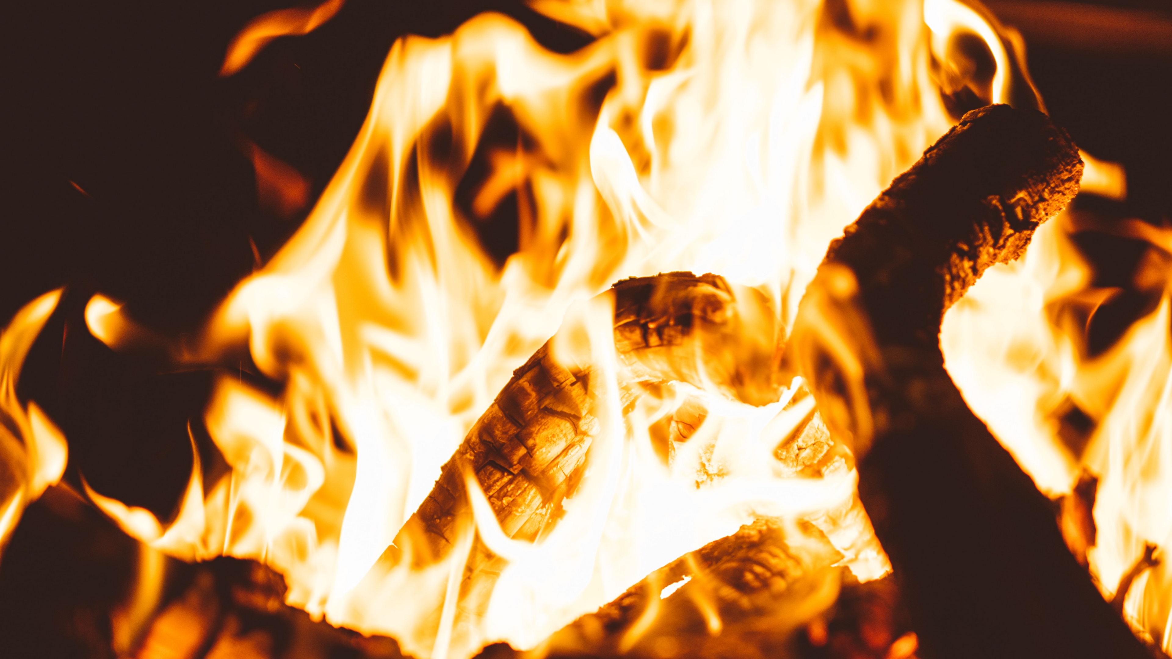 bonfire fire flame firewood dark blur 4k 1540575227