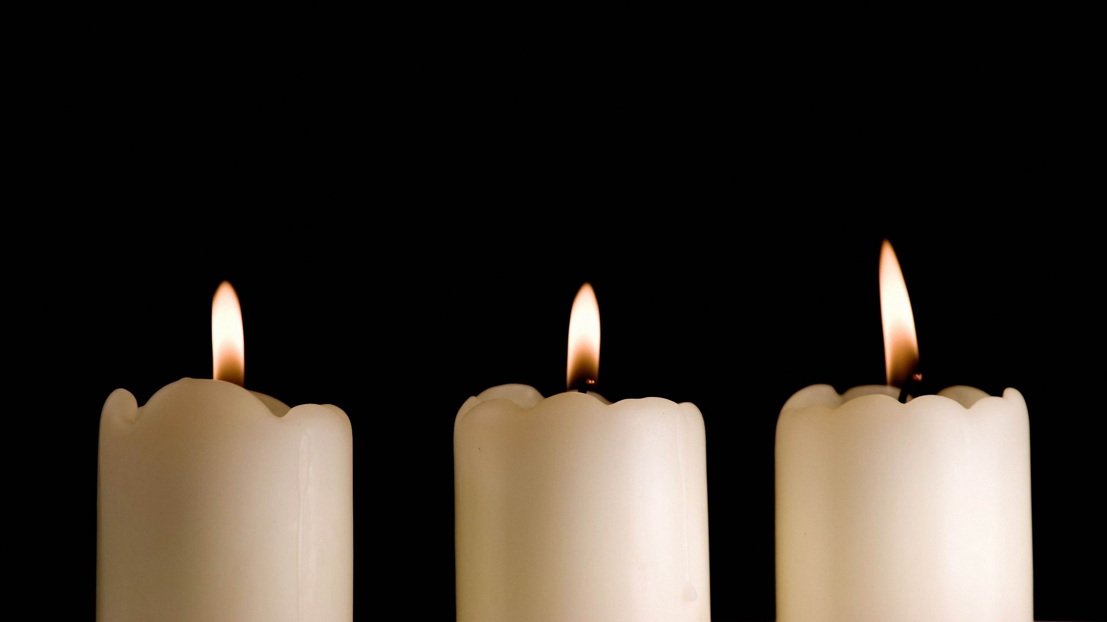 candles lights black background three 4k 1540574930