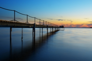 coast sea sunset pier 4k 1540134770