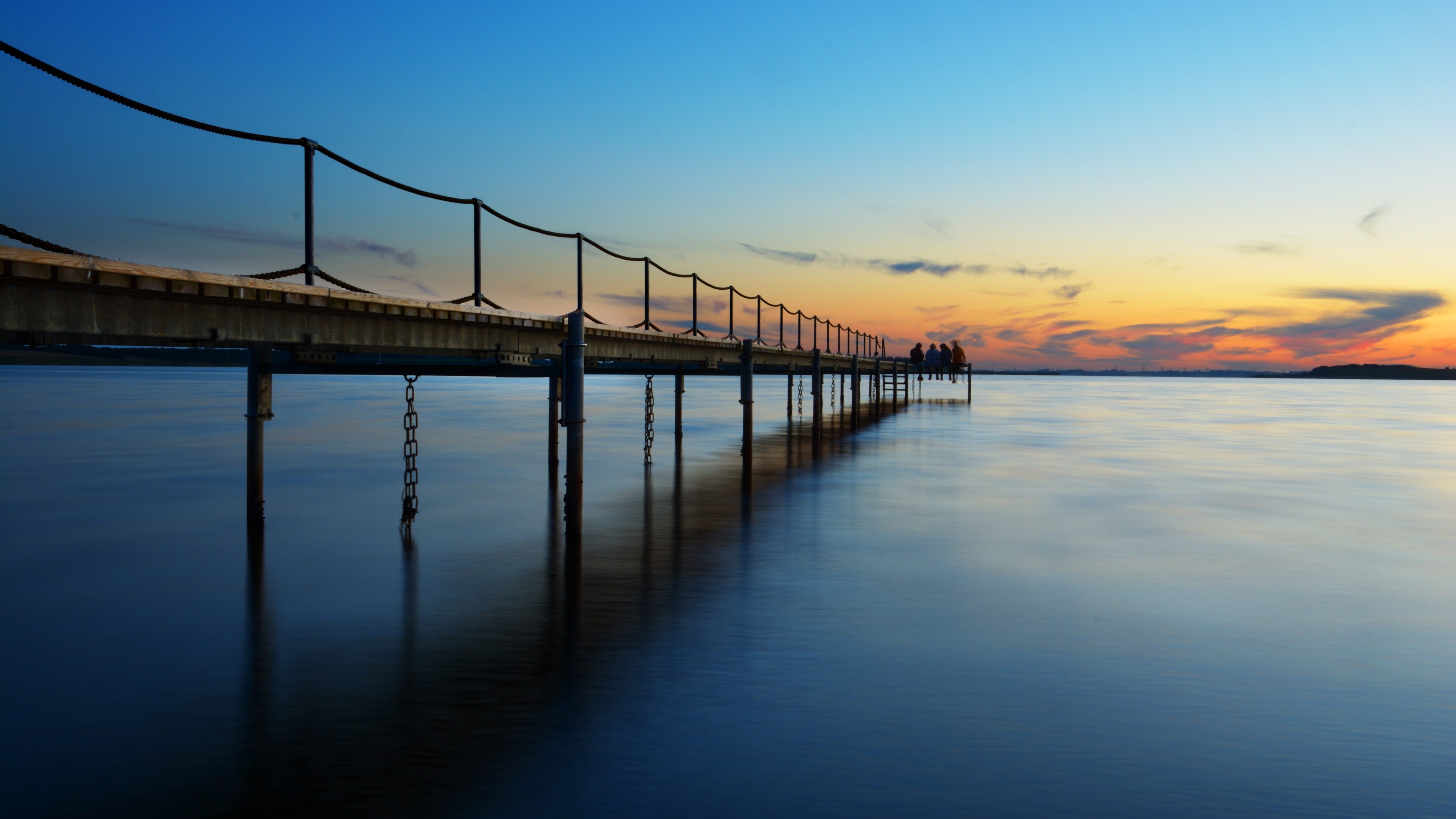 coast sea sunset pier 4k 1540134770