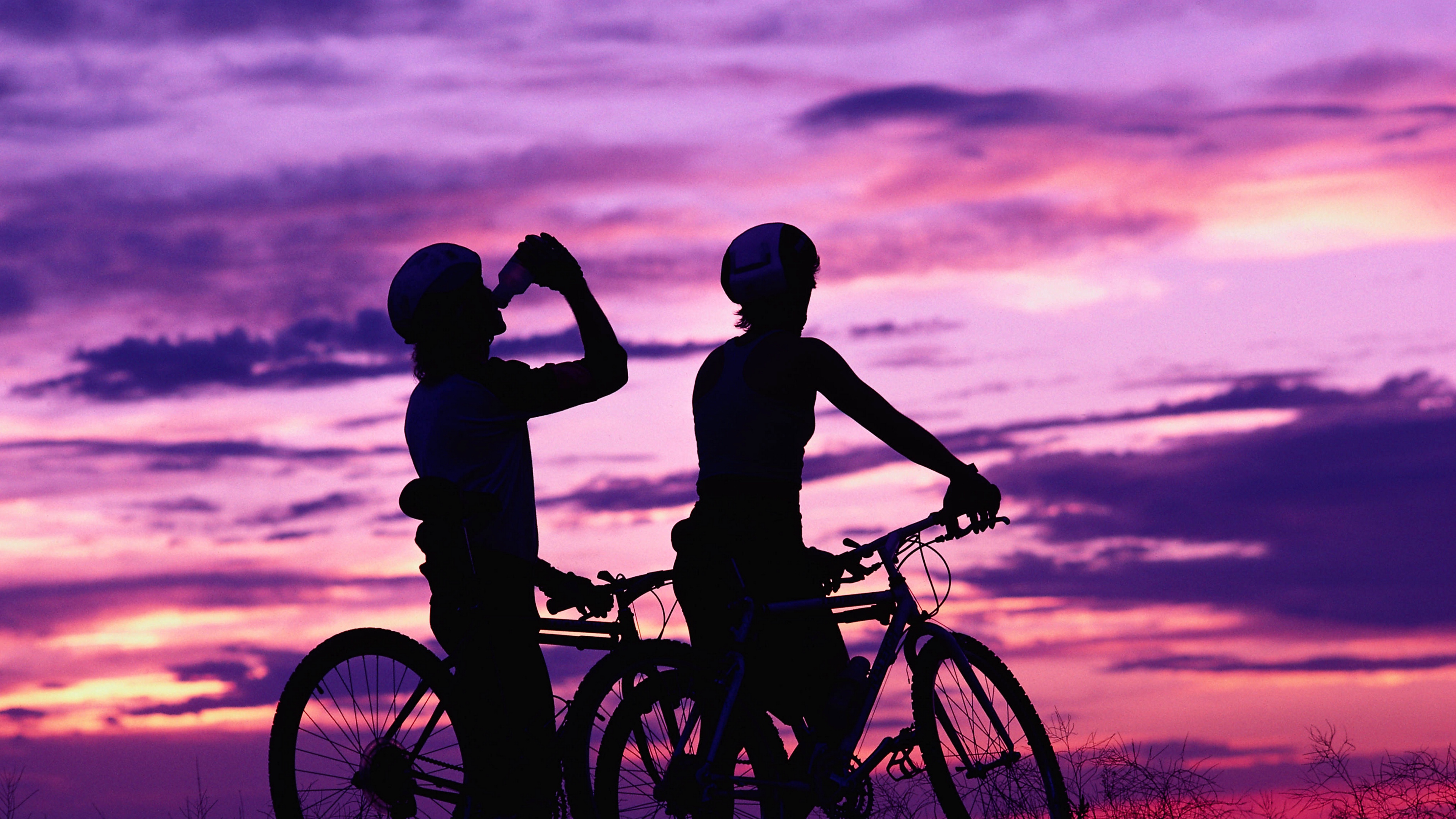 cyclists leisure sport sunset 4k 1540062145