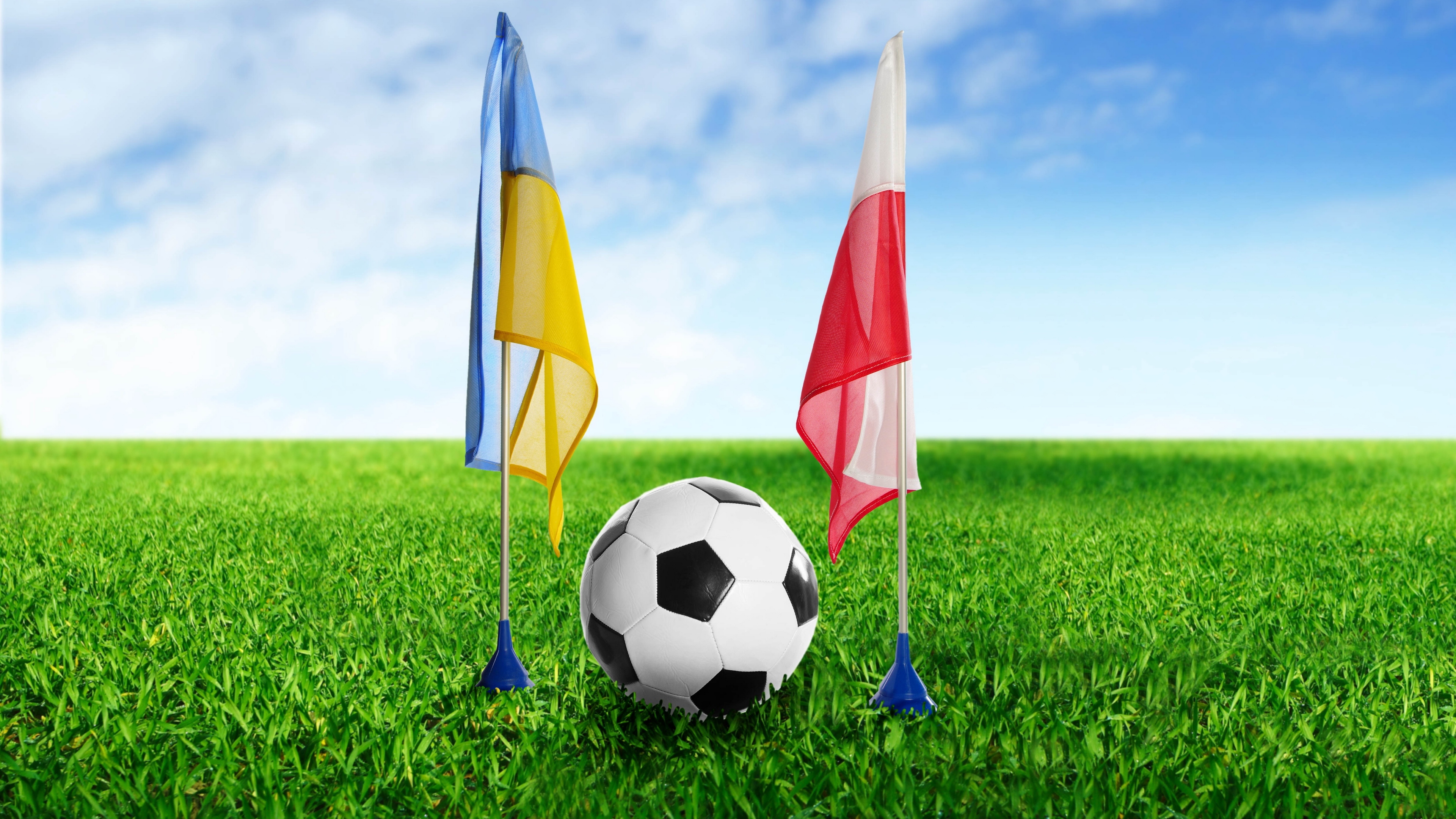 football ukraine poland ball grass flags 4k 1540062329