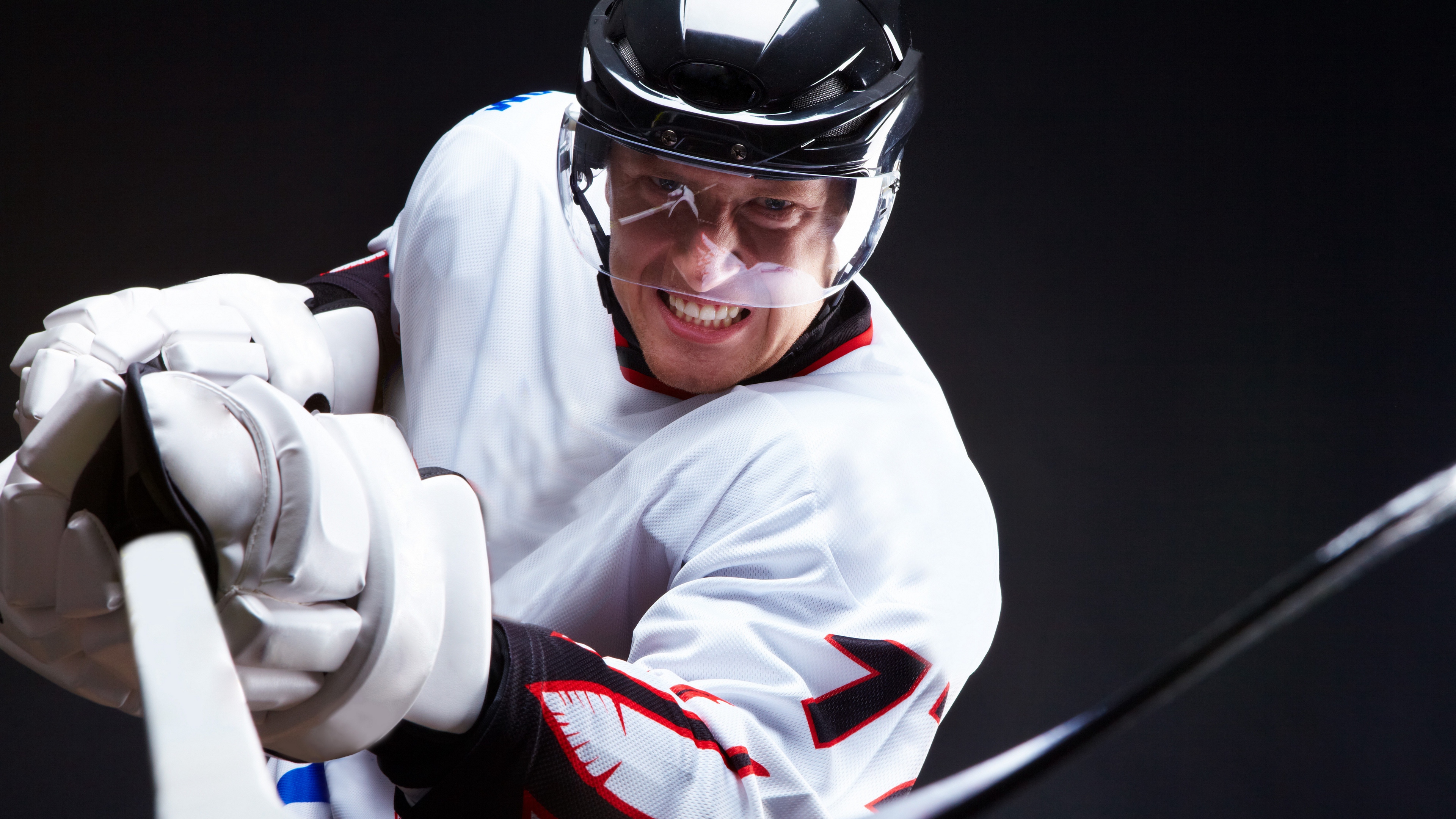 grin hockey hockey stick black background 4k 1540061238