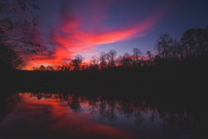 horizon sunset river reflection trees sky 4k 1540576234