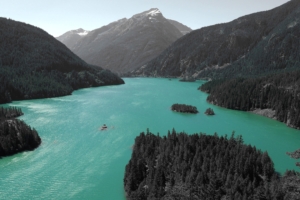 lake in the middle of mountains 4k 1540140115