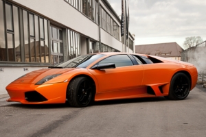 lamborghini murcielago lp640 orange side view black wheels building windows fence sky clouds 4k 1538935534