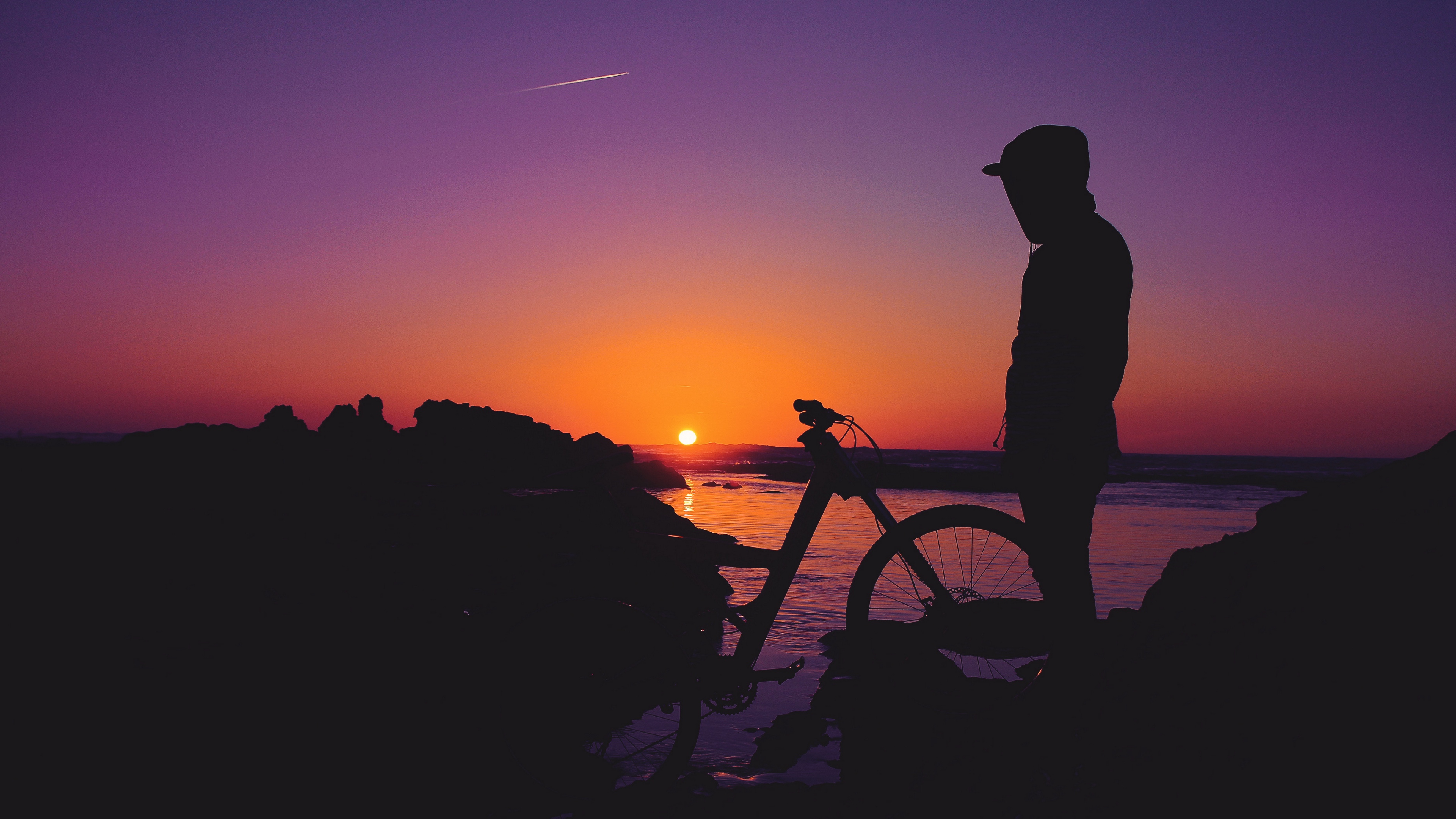 man silhouette bicycle sunset 4k 1540576069