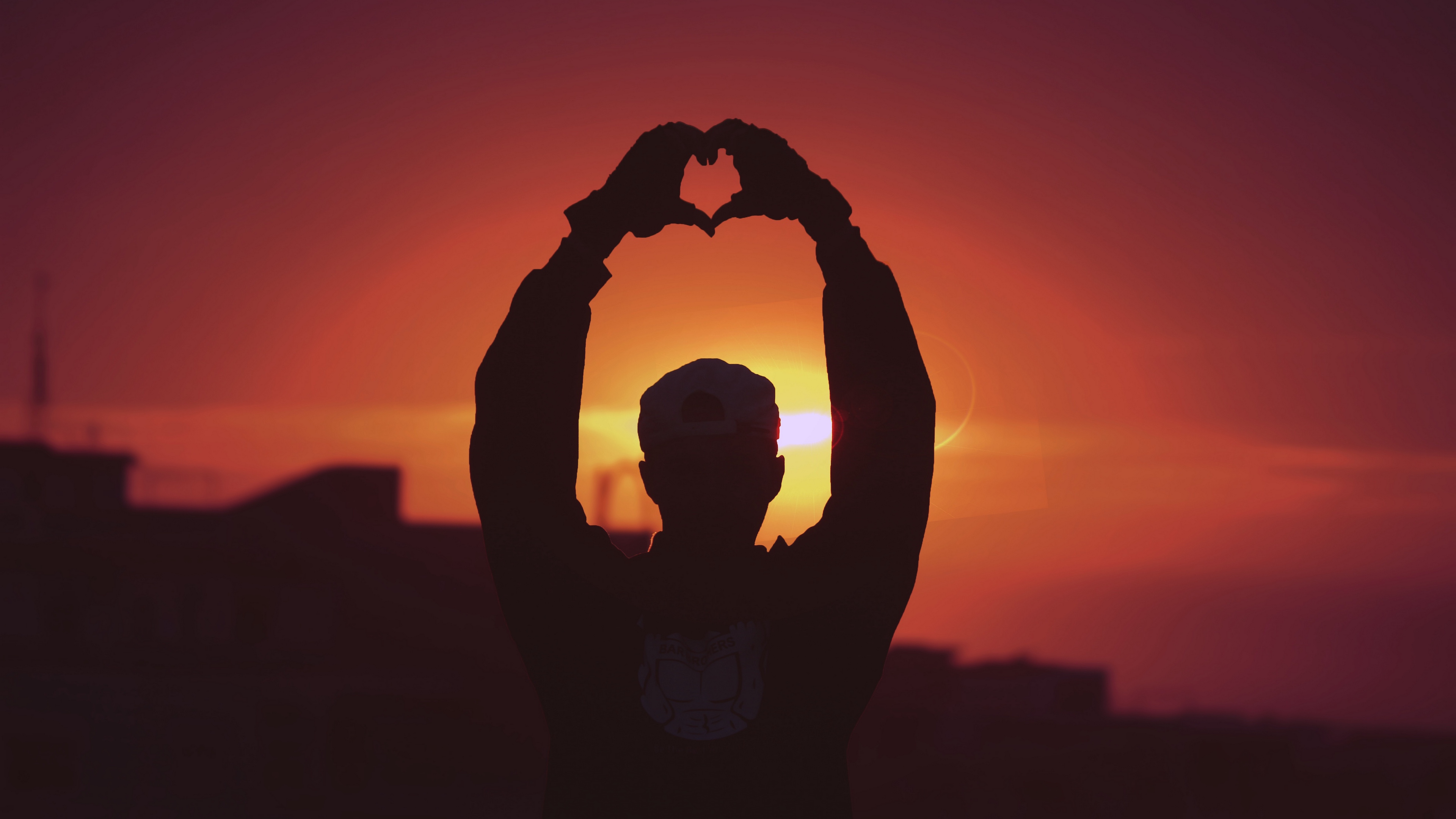 man silhouette heart sunset hands 4k 1540574890