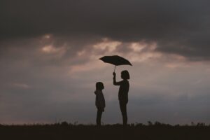 mother child care umbrella silhouettes sky 4k 1540575782