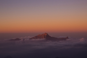 mountain peak from clouds 5k 1540142974