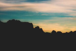 rocks mountains sky clouds 4k 1540575066