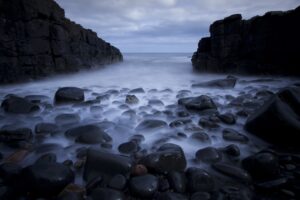 rocks pebbles sea ocean beach 4k 1540136940