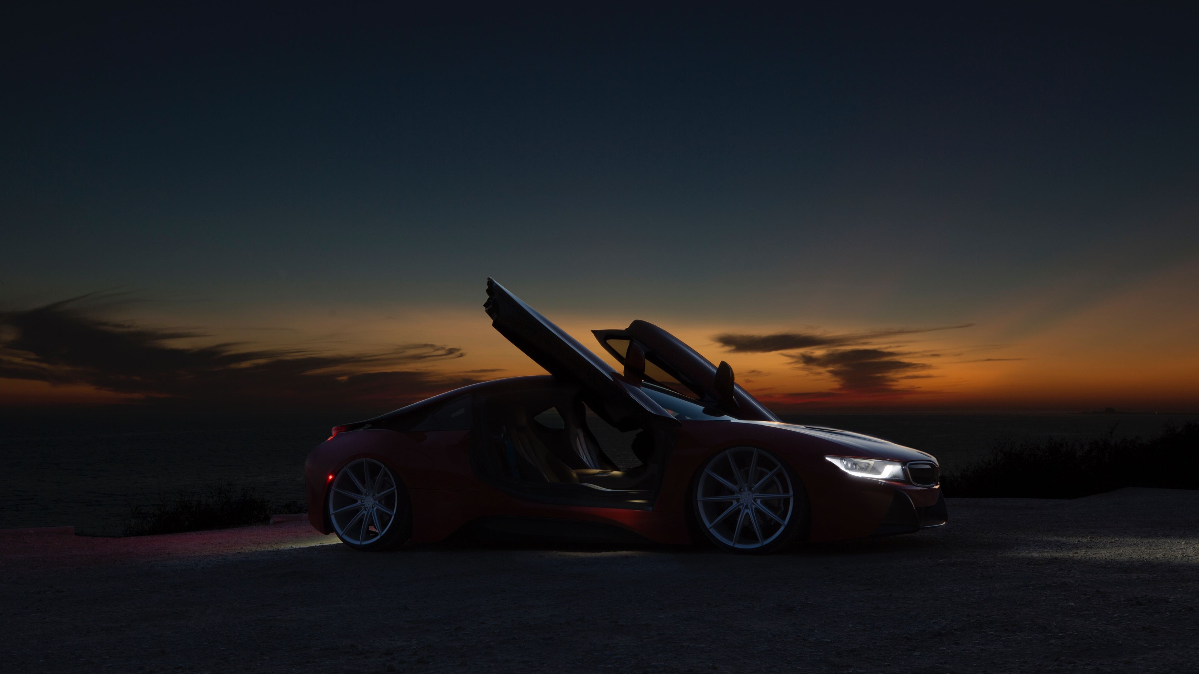 sports car sunset by beach 5k 1539113657