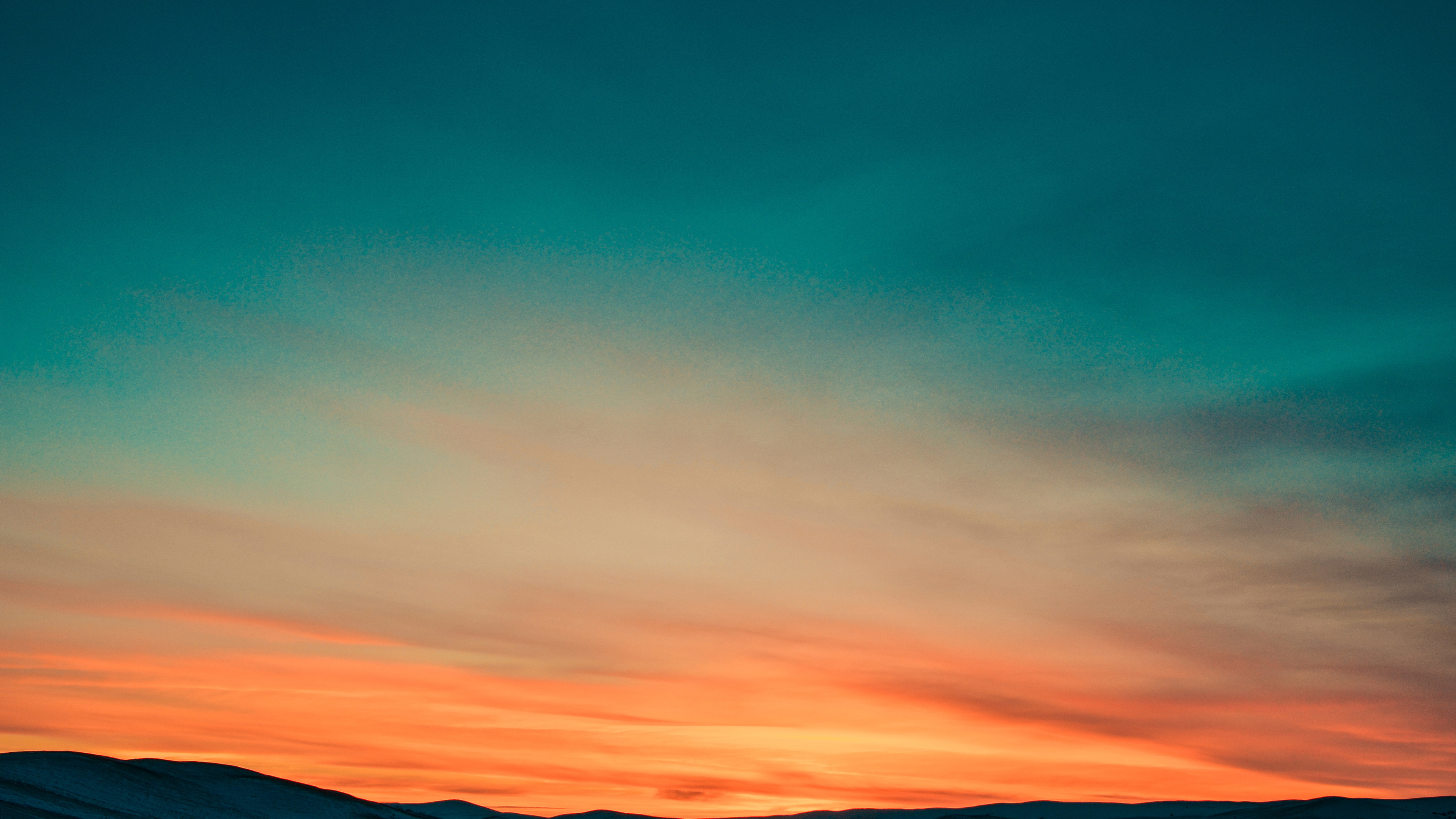 sunset over mountains covered by snow 4k 1540136456