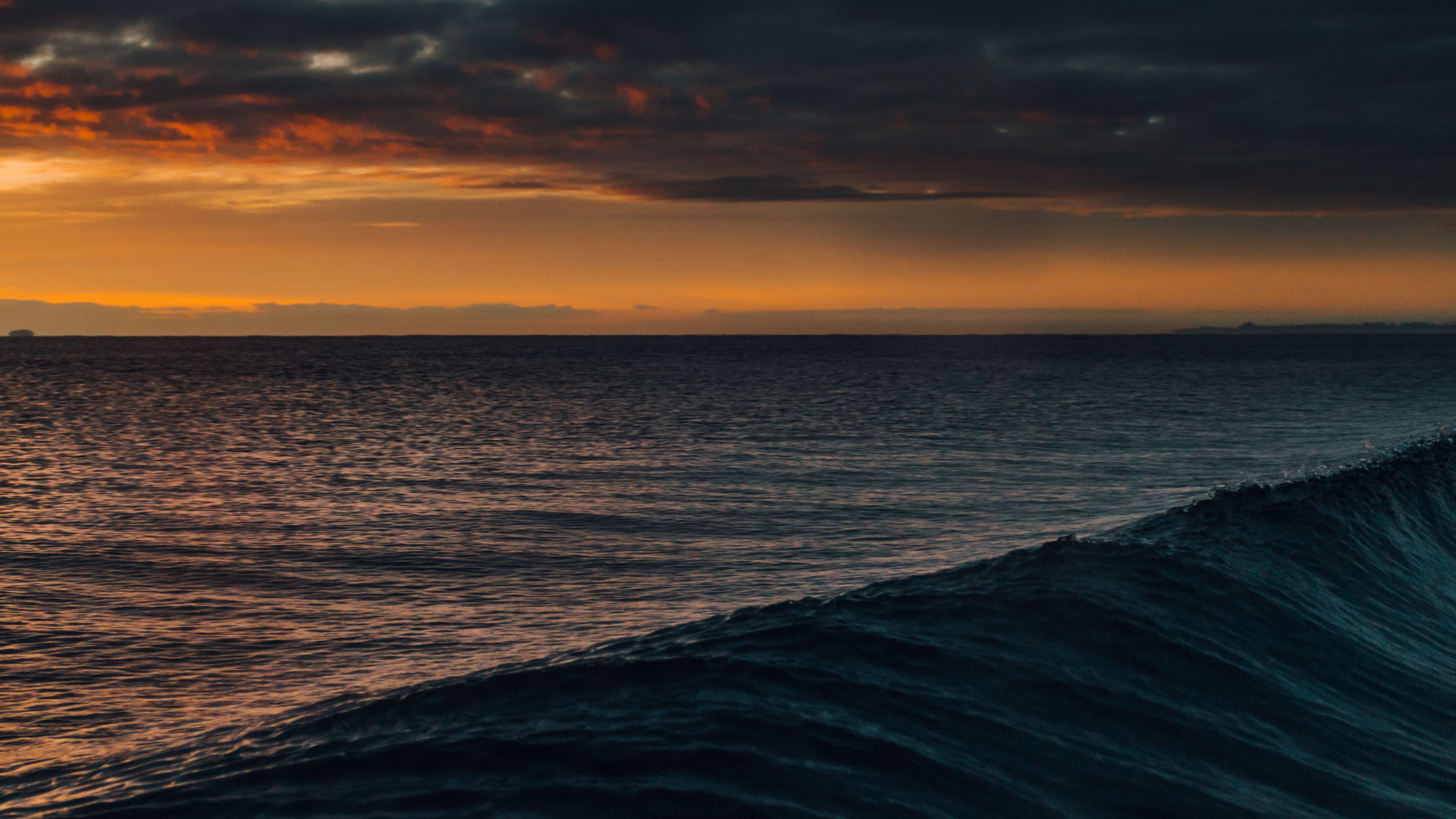 waves cloudscape dark orange 4k 1540143644