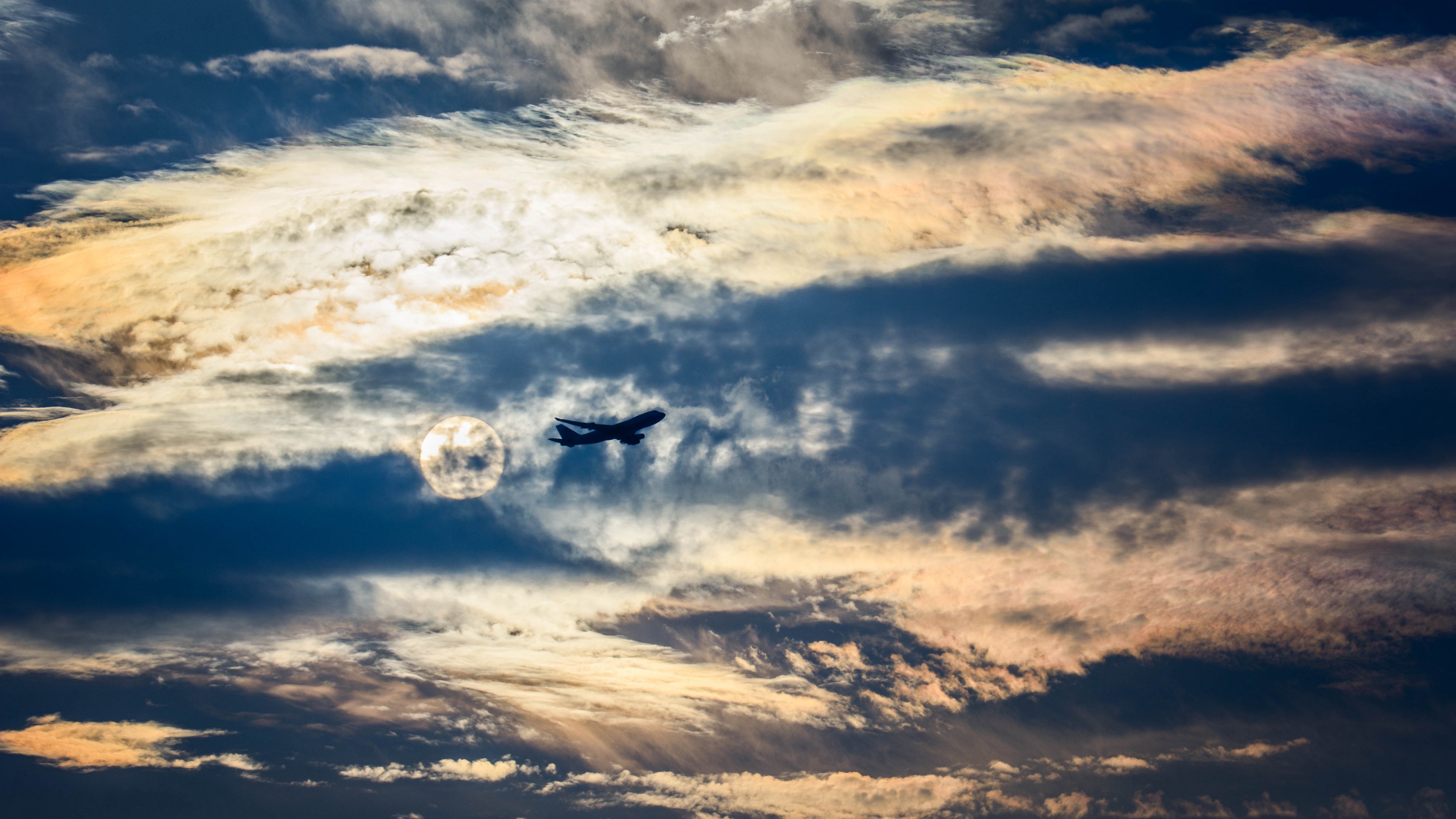 airplane clouds flight sky outlines 4k 1541115520