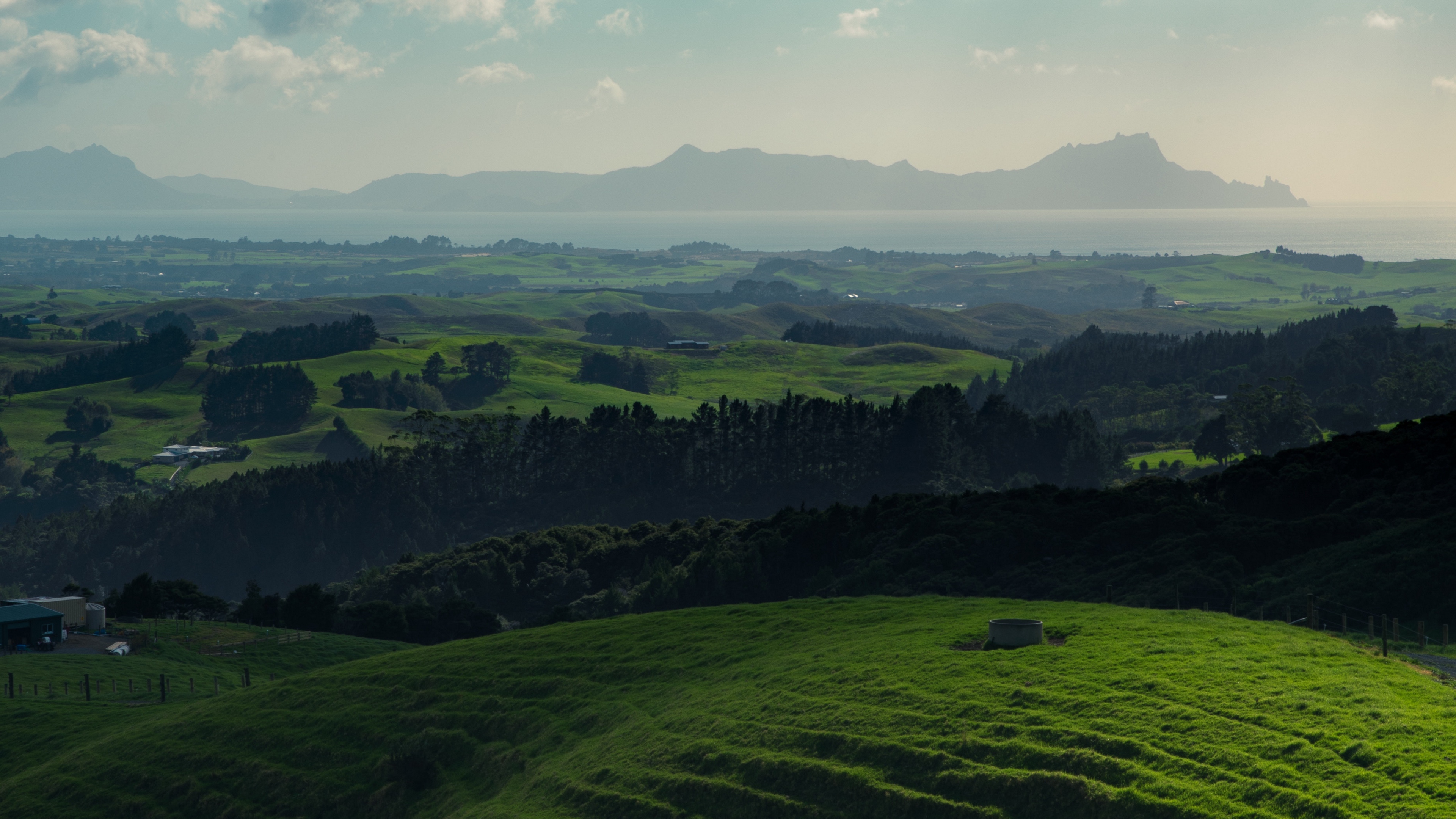 hills grass mountains horizon whangarei new zealand 4k 1541115165