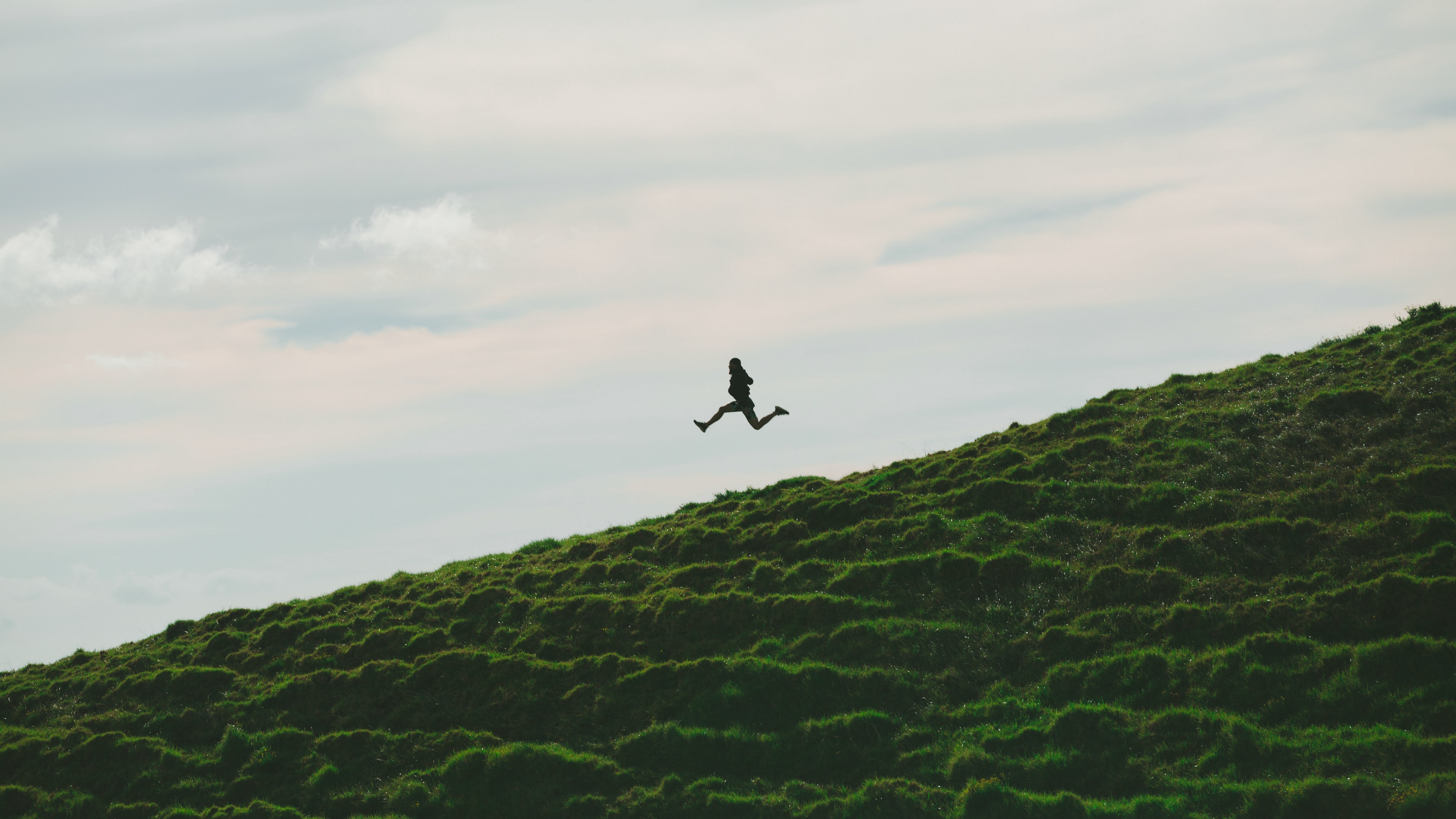 man jump minimalism sky grass 4k 1541115934