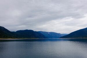 mountains lake sky clouds 4k 1541116298