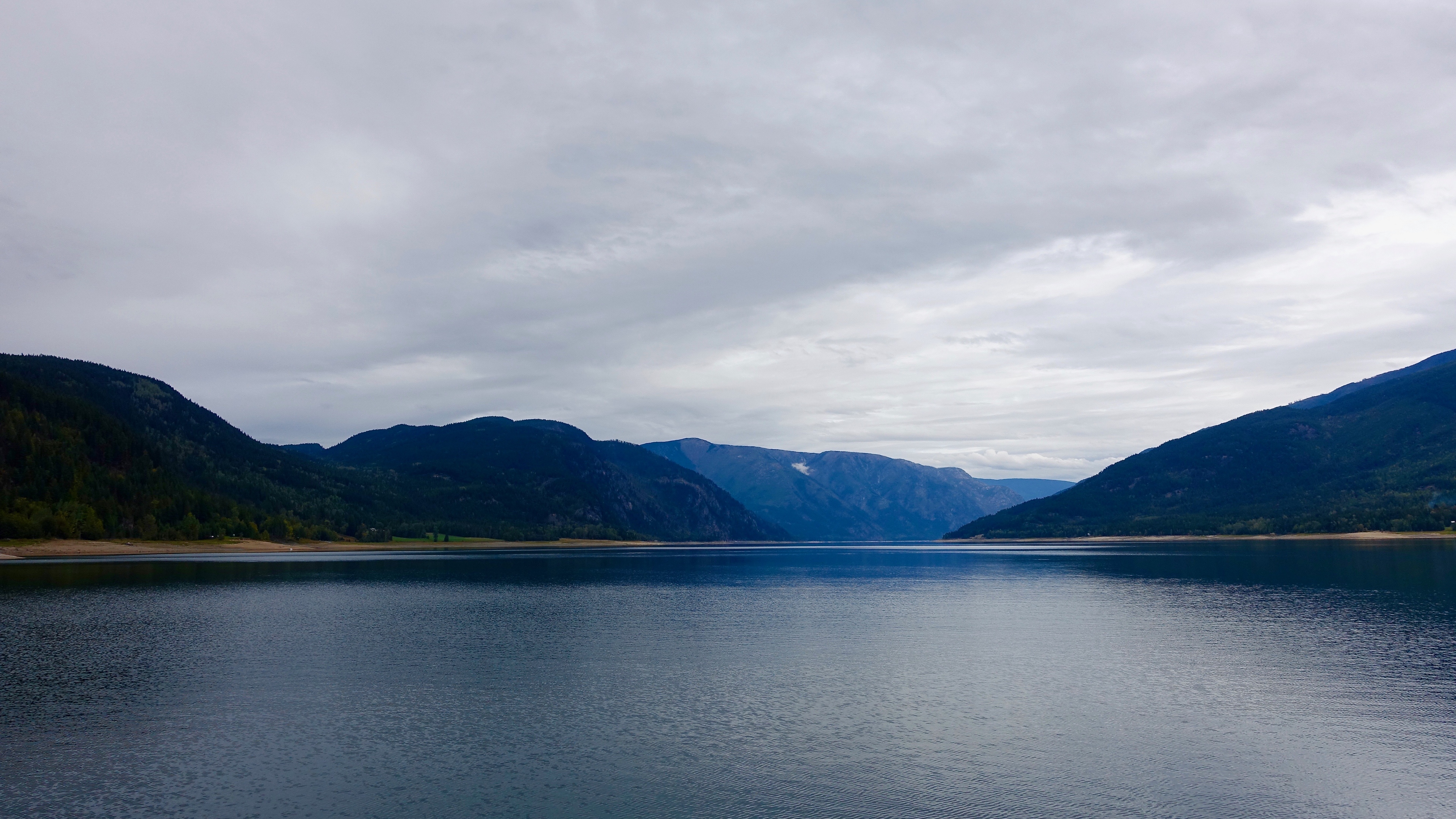 mountains lake sky clouds 4k 1541116298