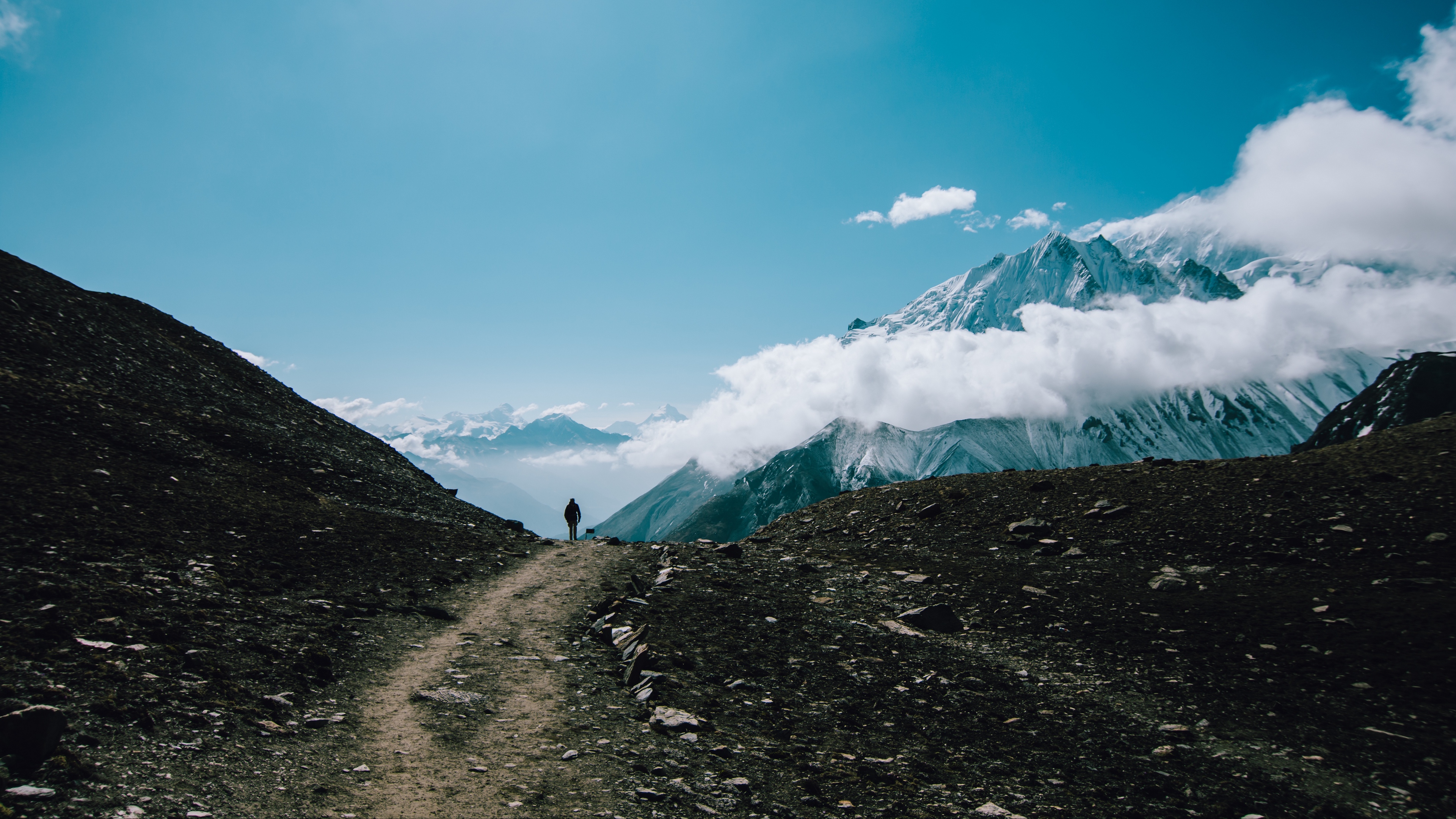 mountains man tourist clouds 4k 1541114813