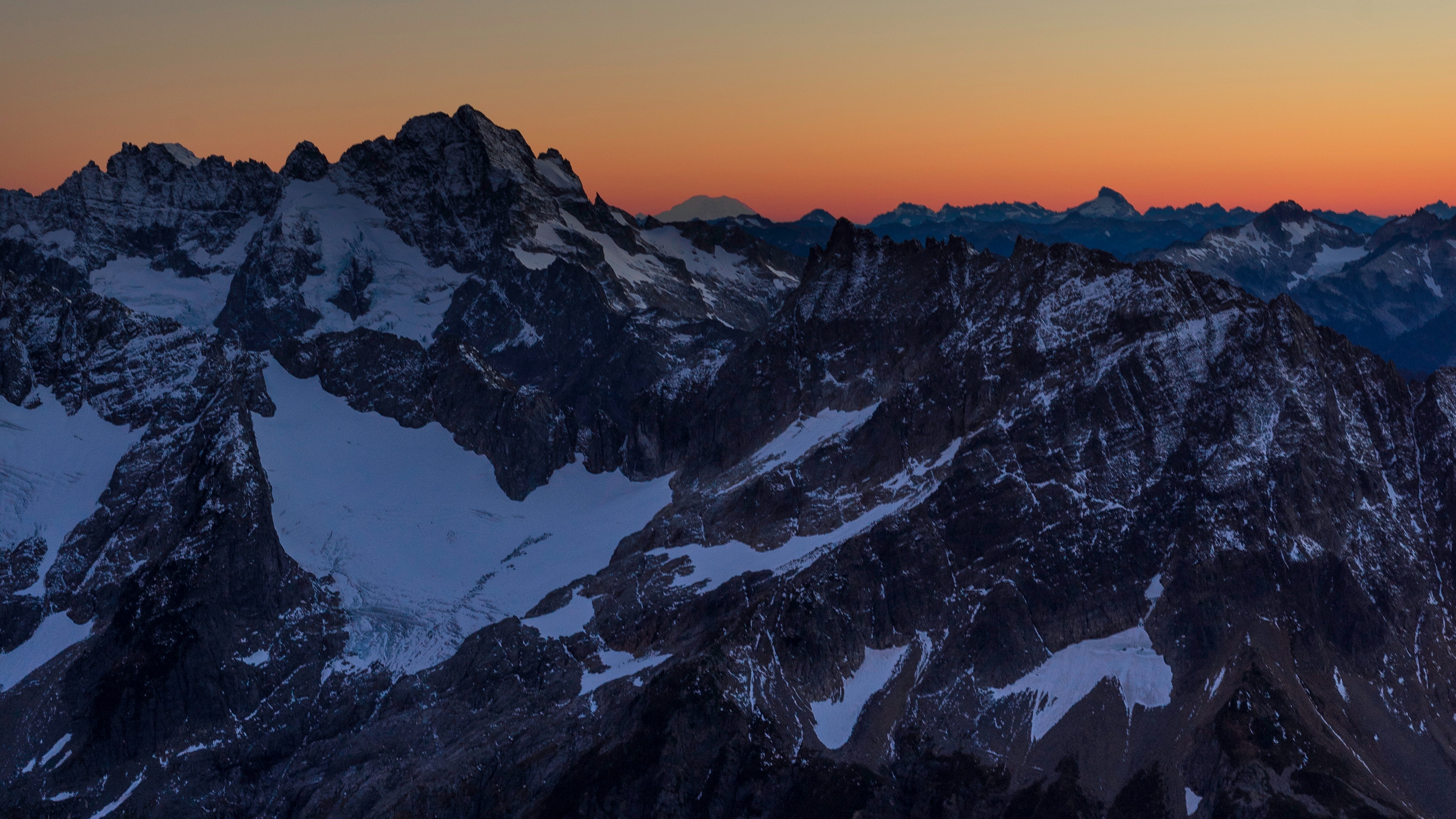 mountains peaks snowy sunset evening sky 4k 1541113735