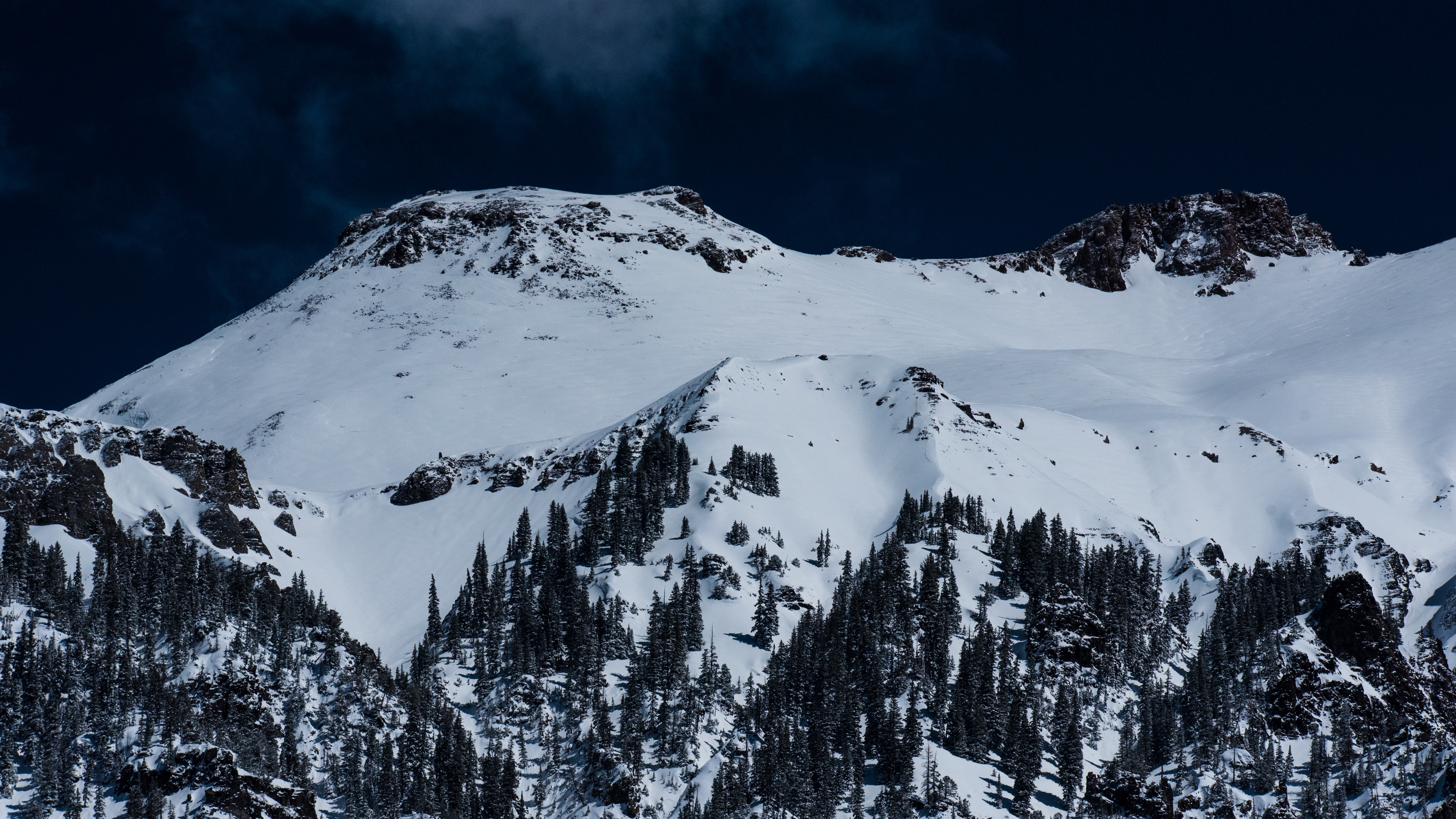 mountains snow trees top 4k 1541114696