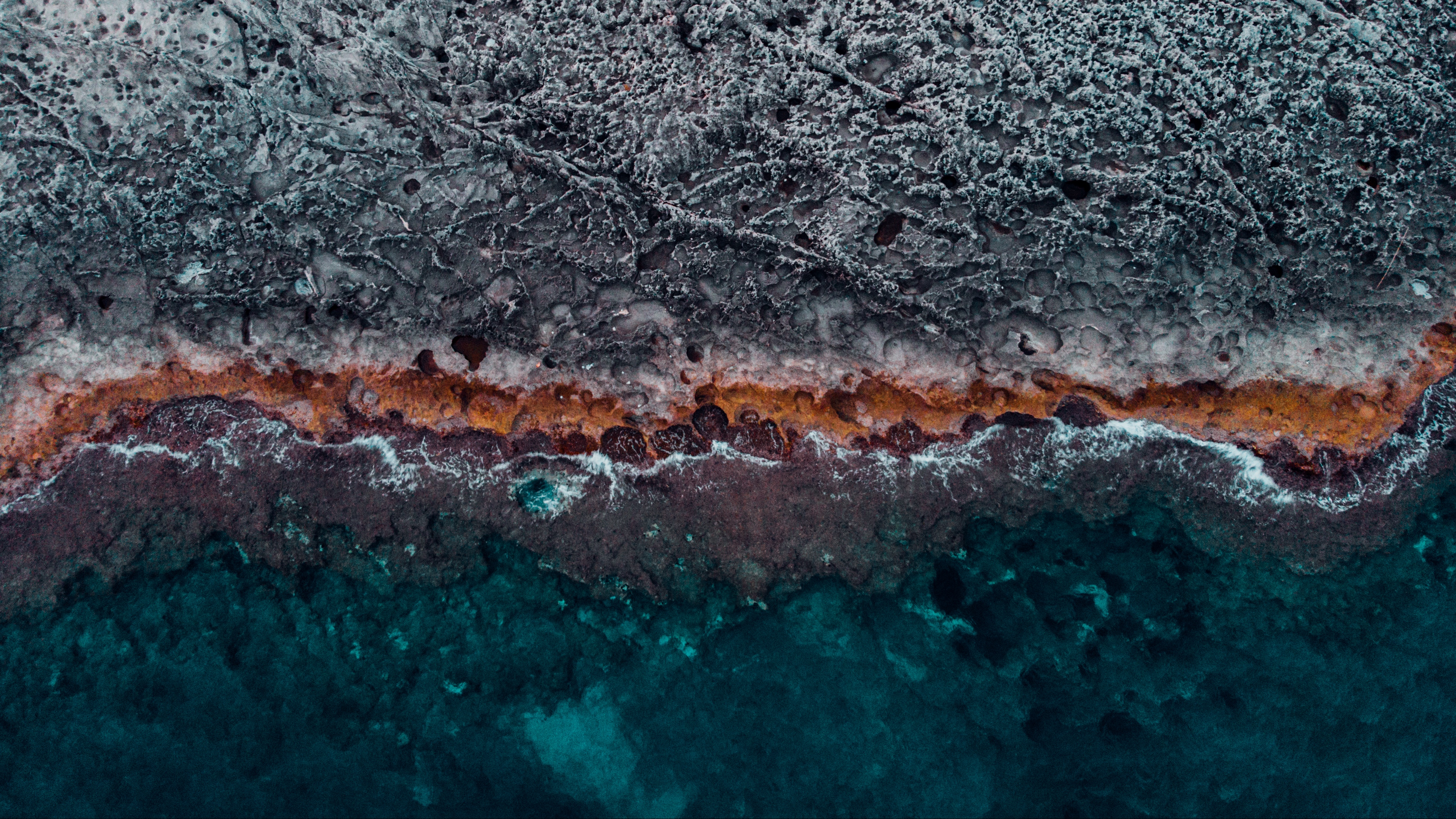 ocean coast aerial view water stones surface ribbed 4k 1541113732