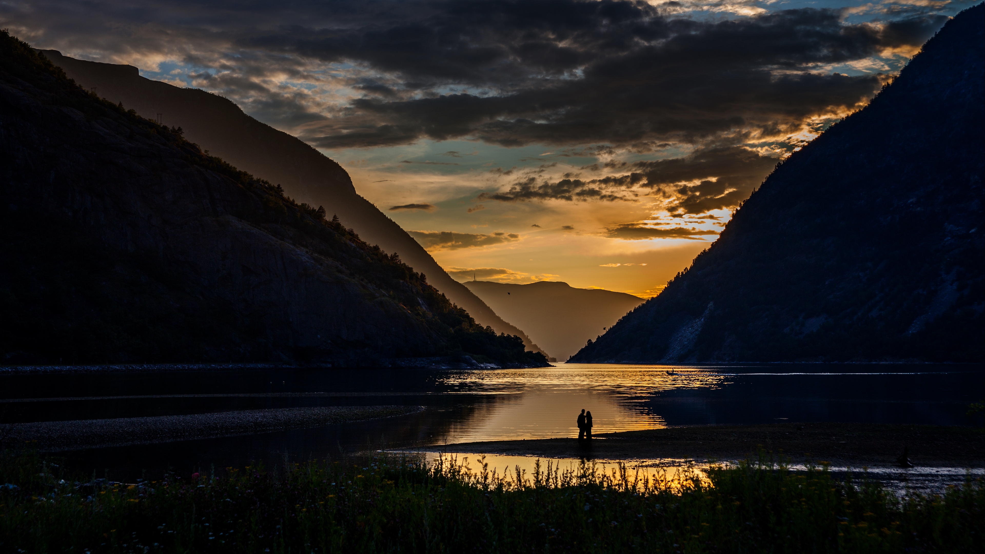 silhouettes couple mountains lake sunset clouds norway 4k 1541116882