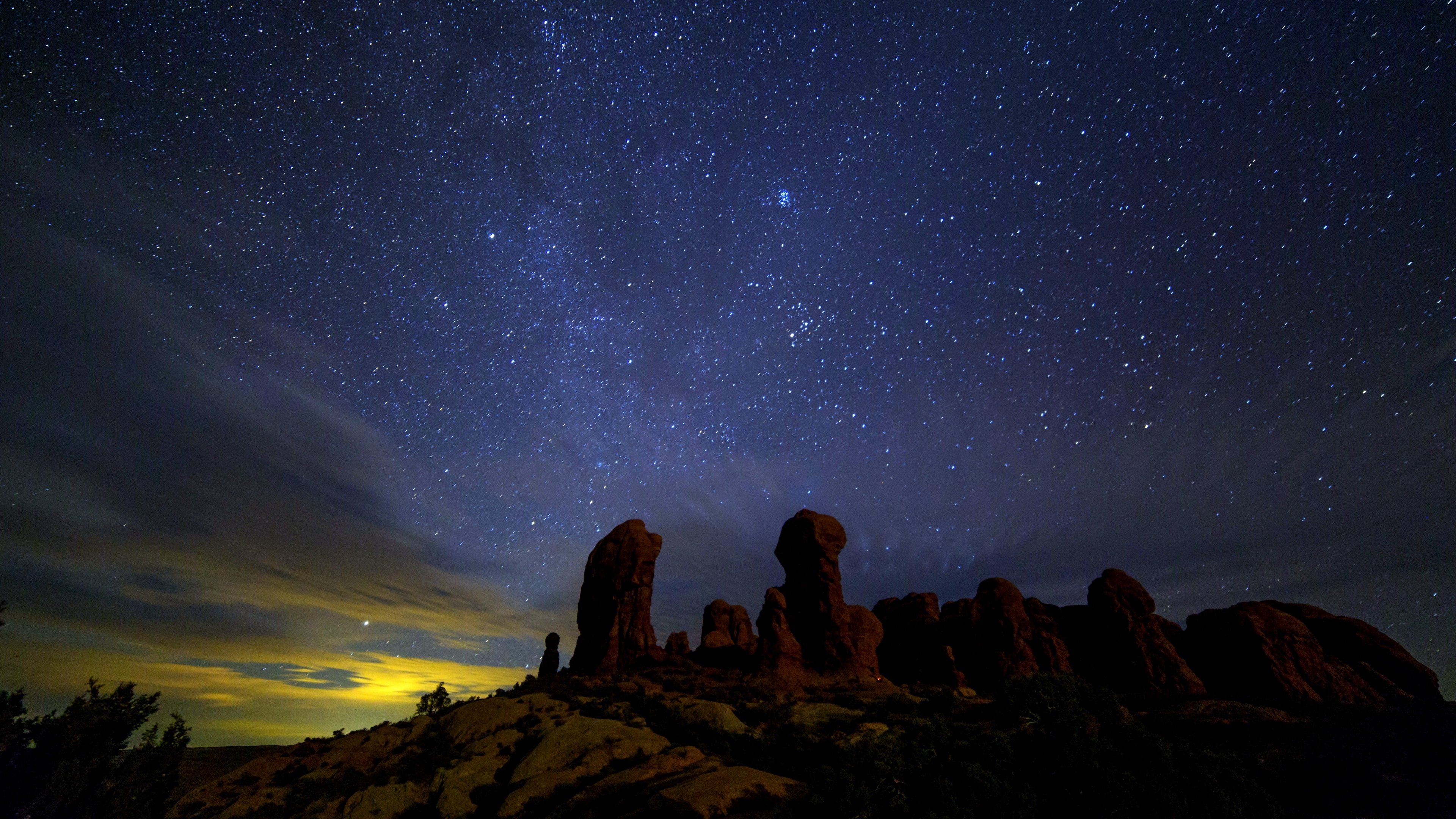 starry sky stars rocks night 4k 1541114509