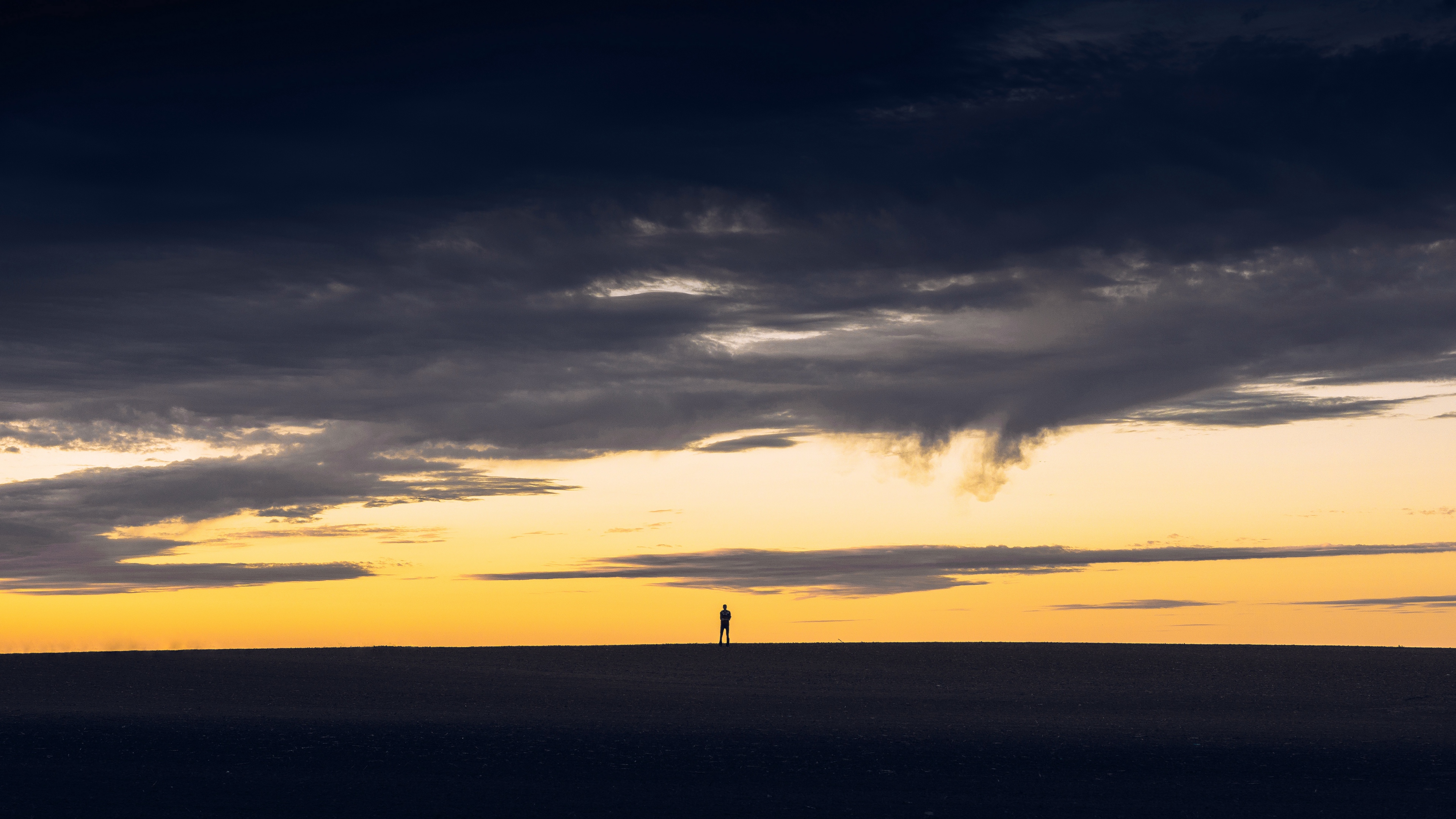 sunset silhouette sky man 4k 1541116453