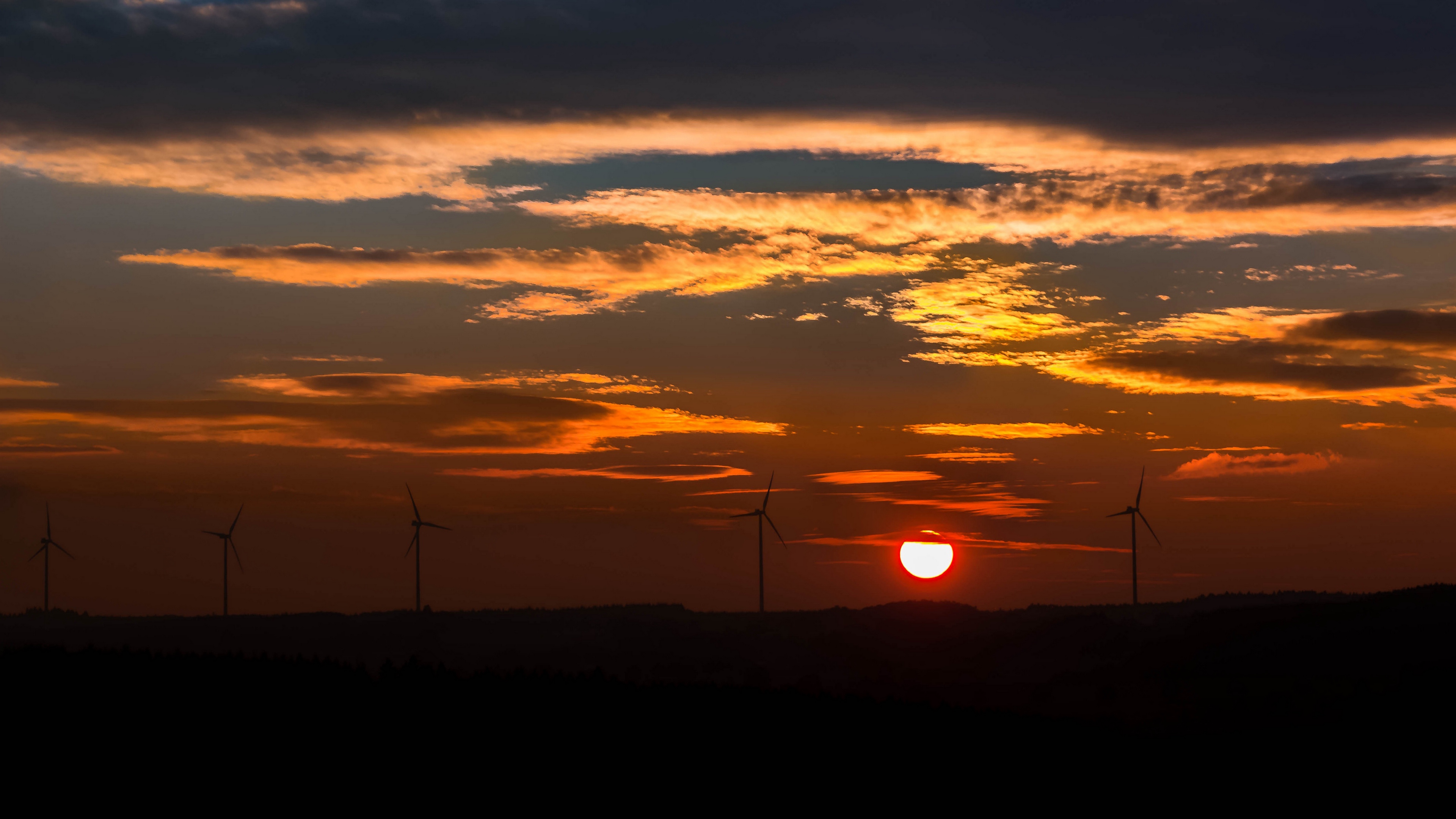 windmills sunset sky 4k 1541114698