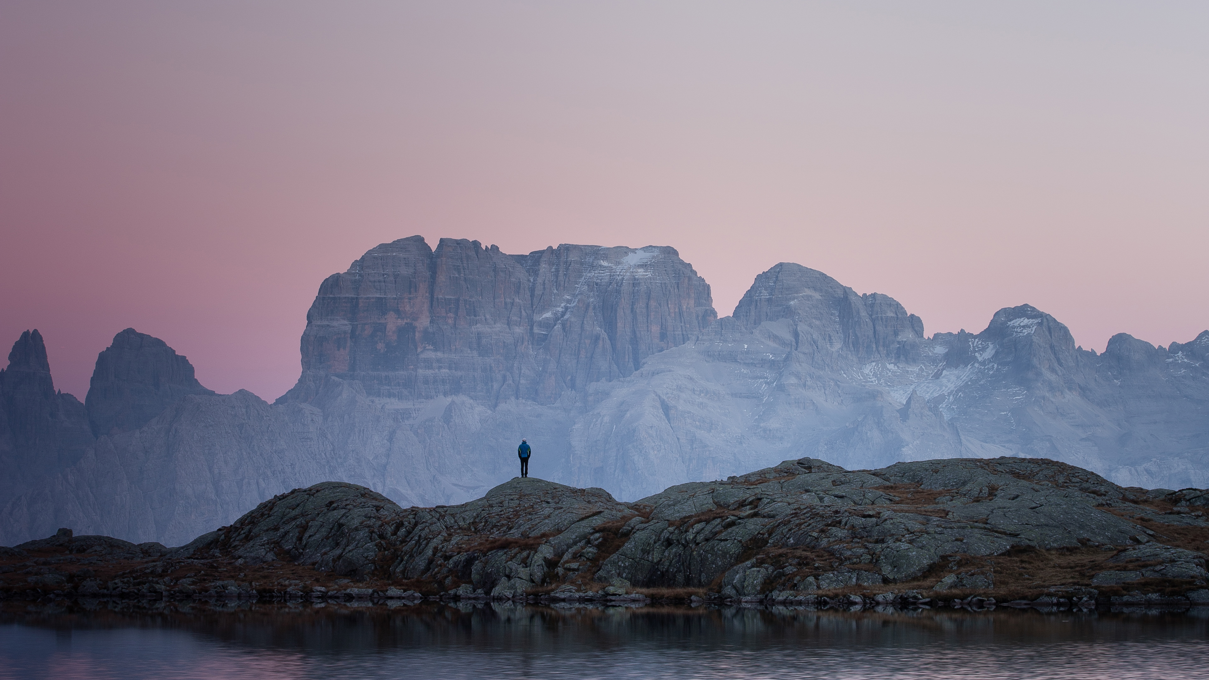 standing on top over rocks mountains 4k 1547320048