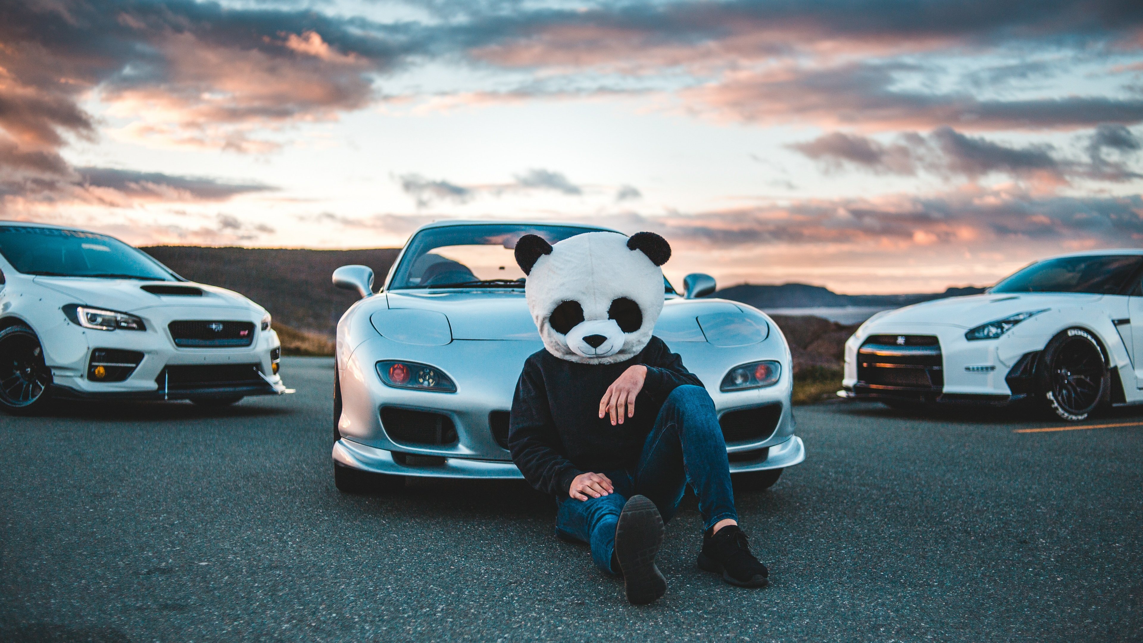 panda helmet guy with cars 4k 1556185172