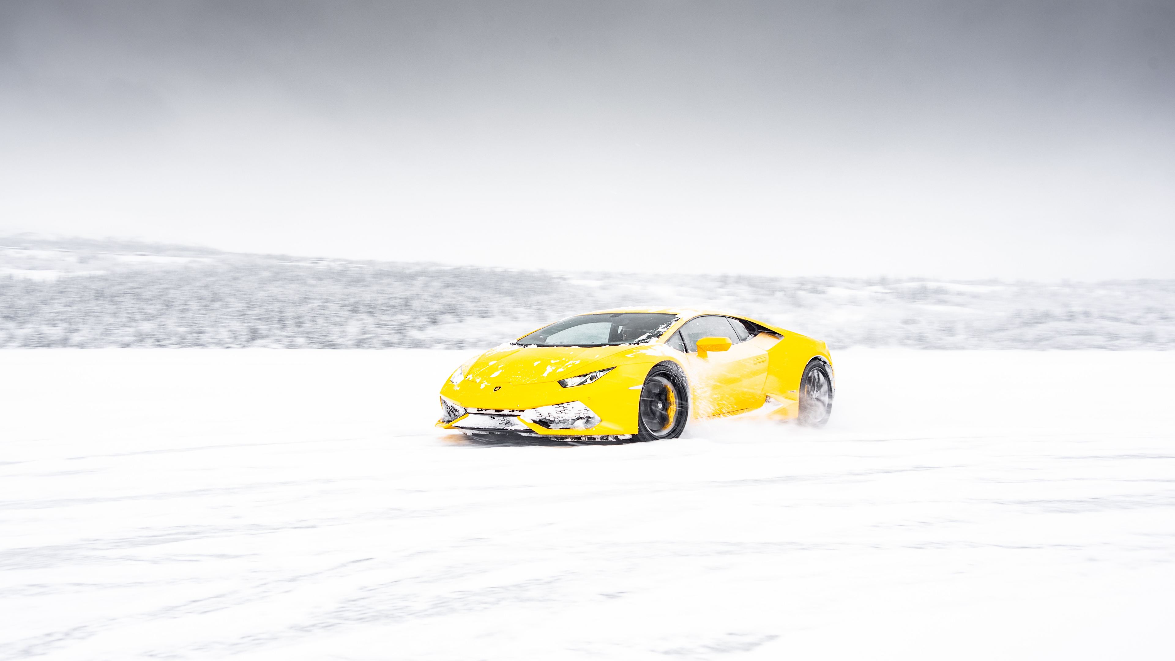 yellow lamborghini aventador in snow 4k 1556185177