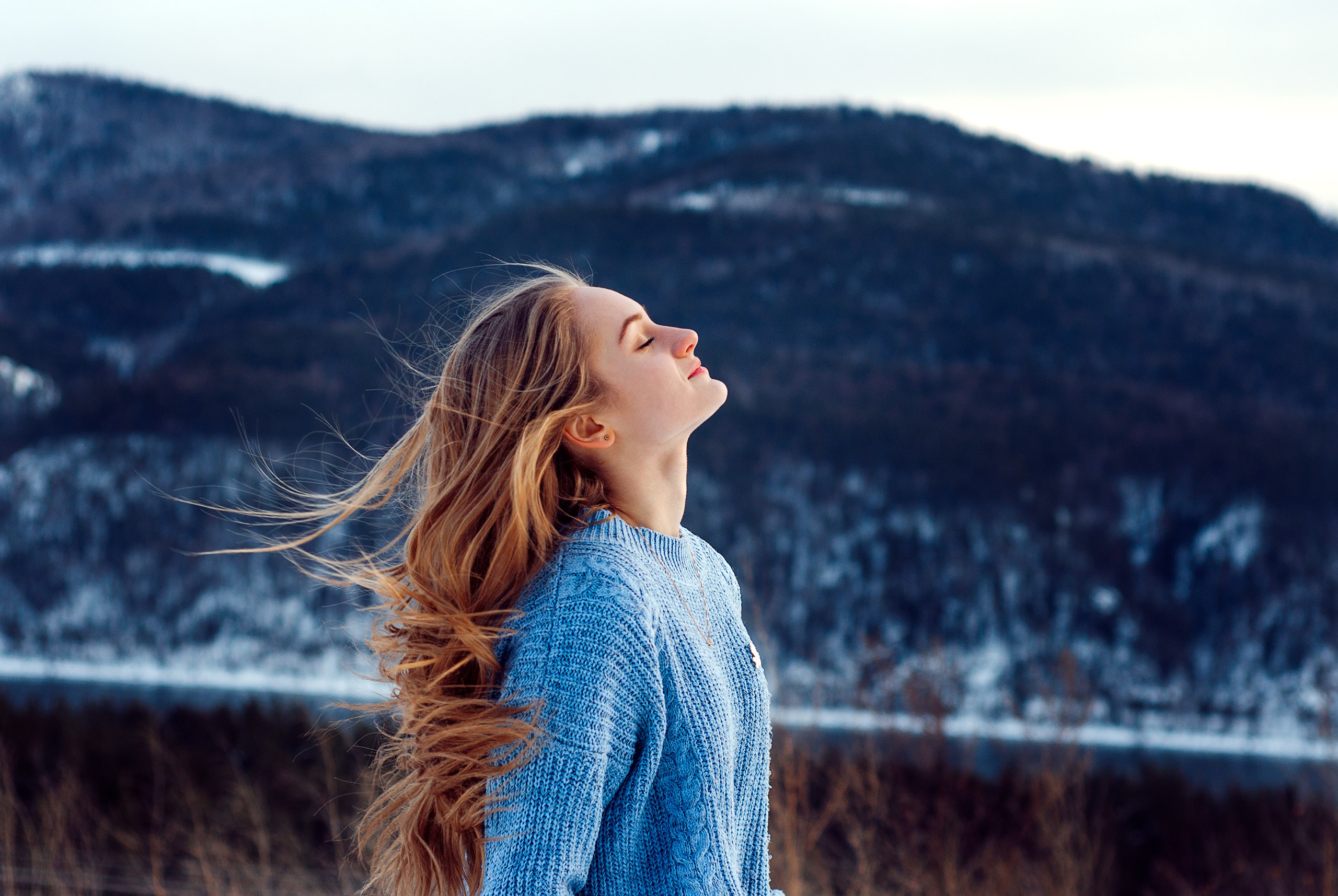 windy weather snow closed eyes girl 1574939448