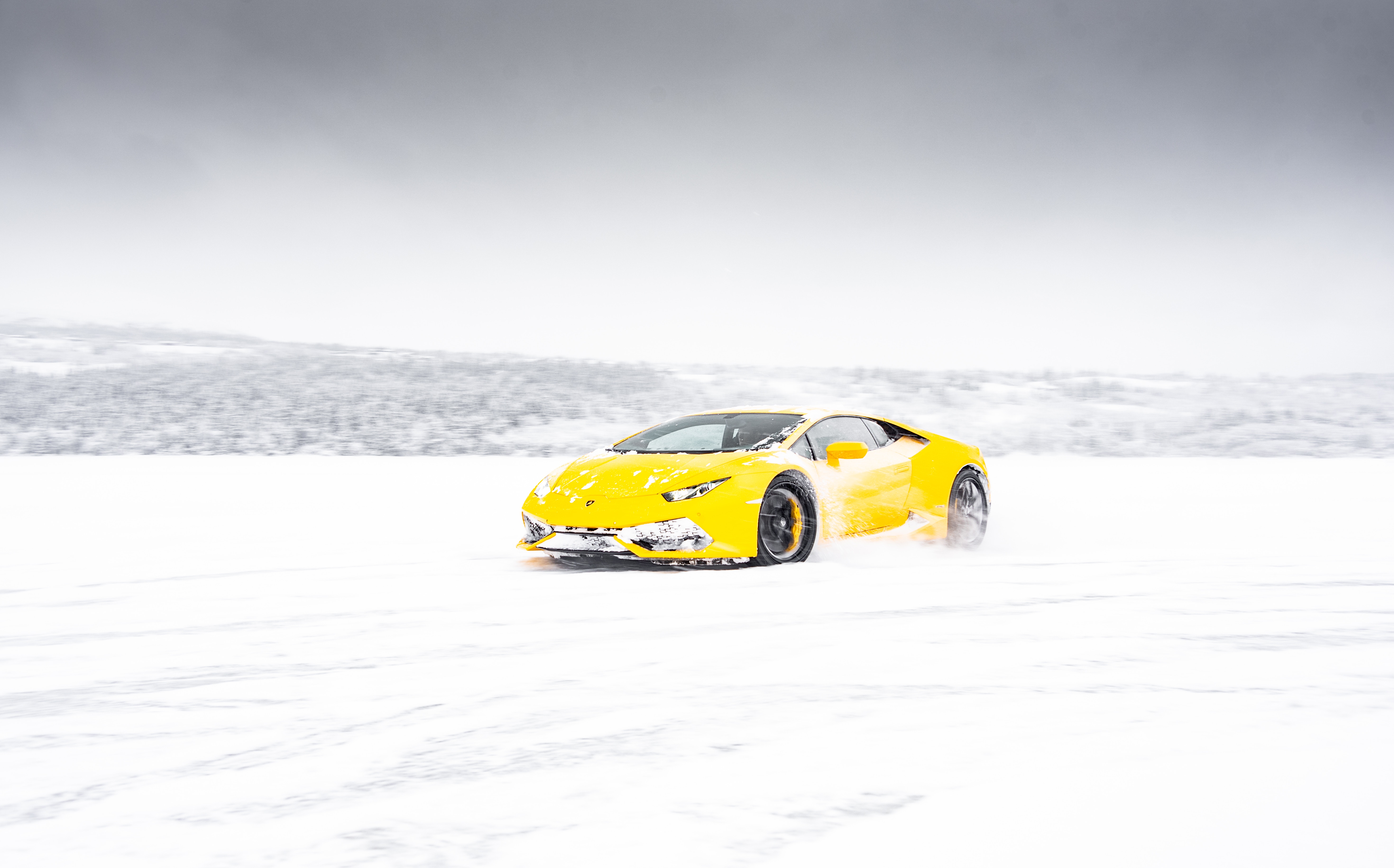 yellow lamborghini aventador in snow 1574939499