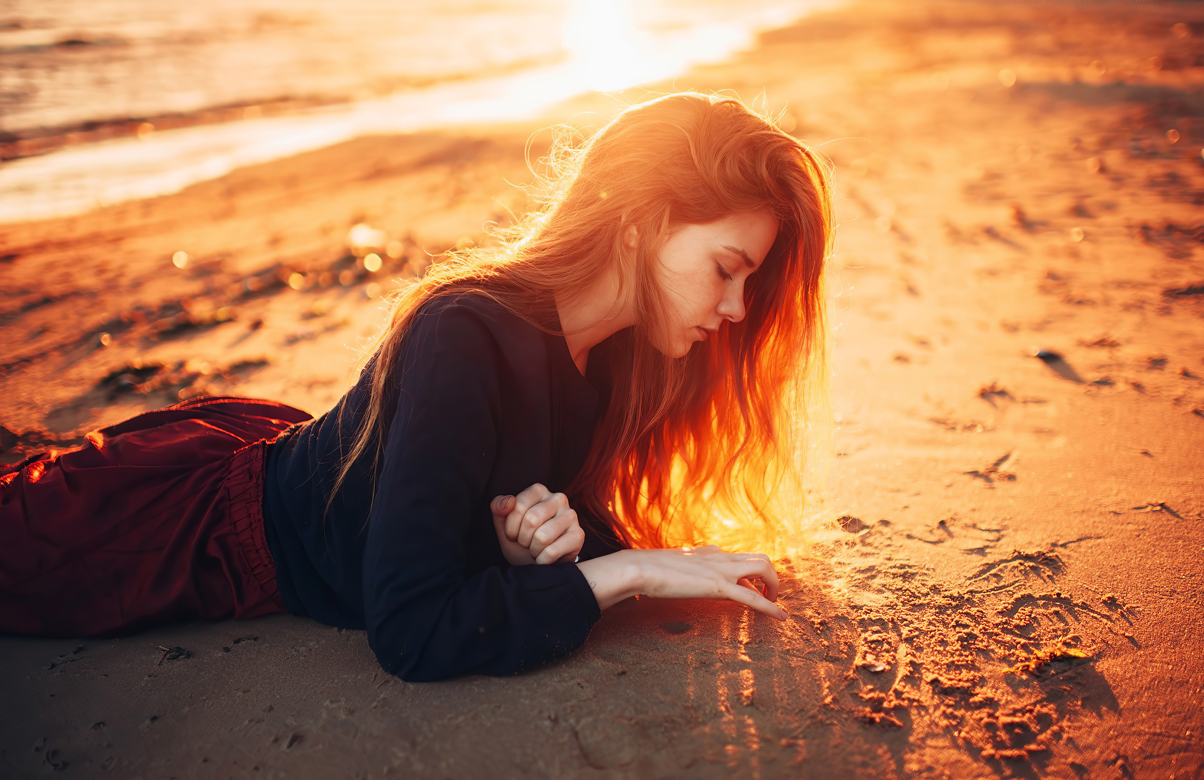 girl beach playing with sand 1575665951