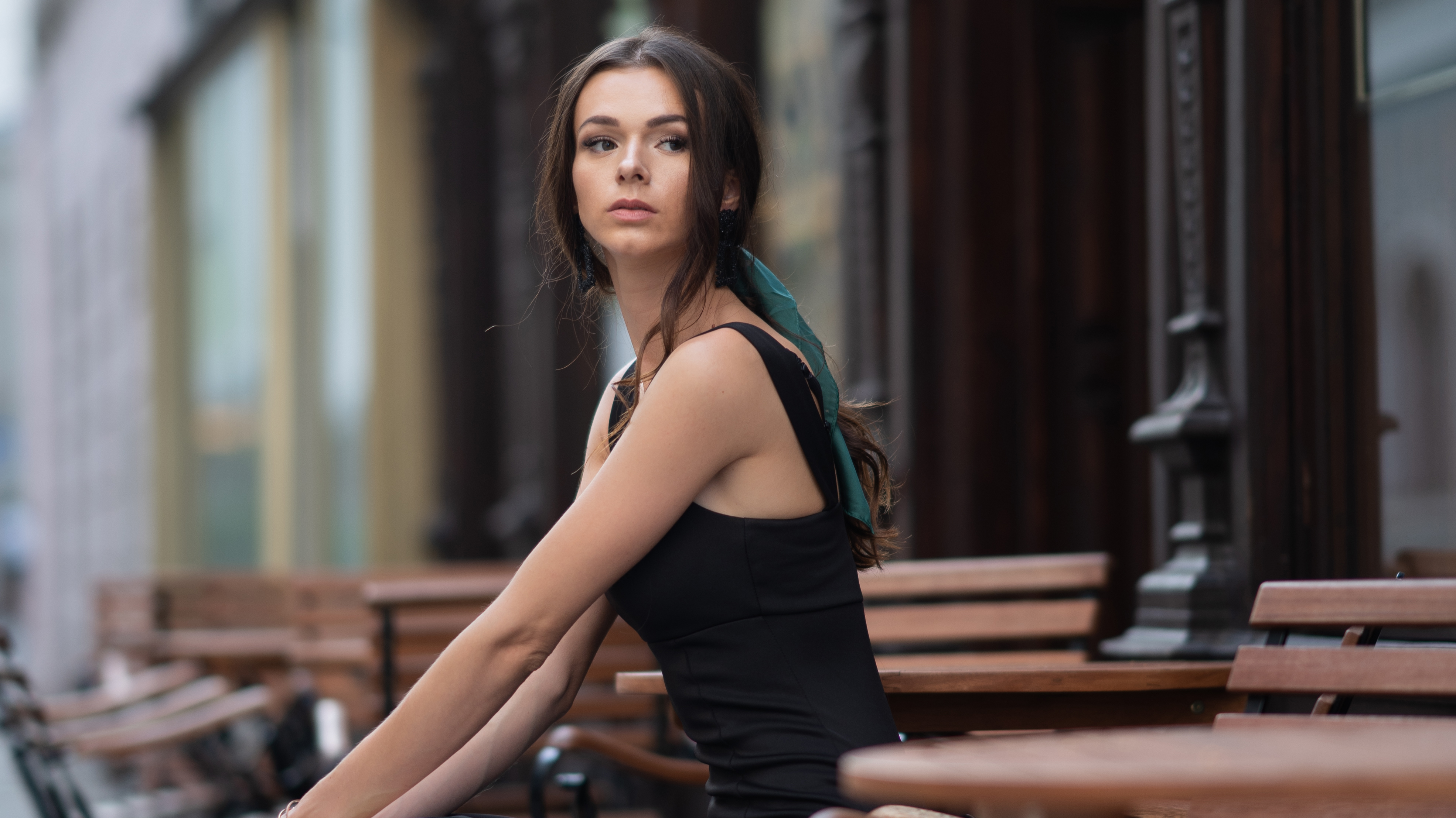 girl outdoor sitting on a bench looking away 1575665886