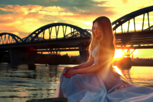 girl sitting on bridge side 1575665541